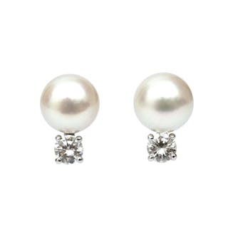 A pair of 14 karat white gold pearl and diamond studs