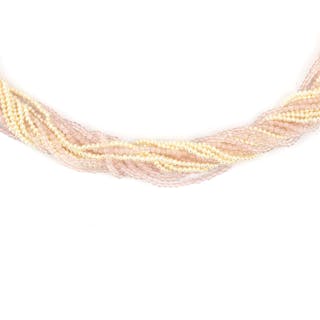 A rose quartz and pearl torsade to a 14 krt. white gold bajonet clasp