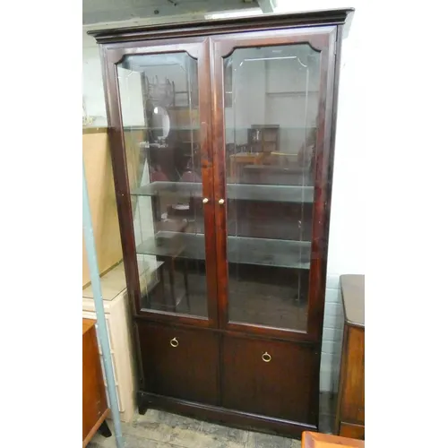 A Stag Minstrel mahogany glazed china display cabinet with c... | Barnebys