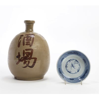 A large Japanese glazed pottery sake bottle