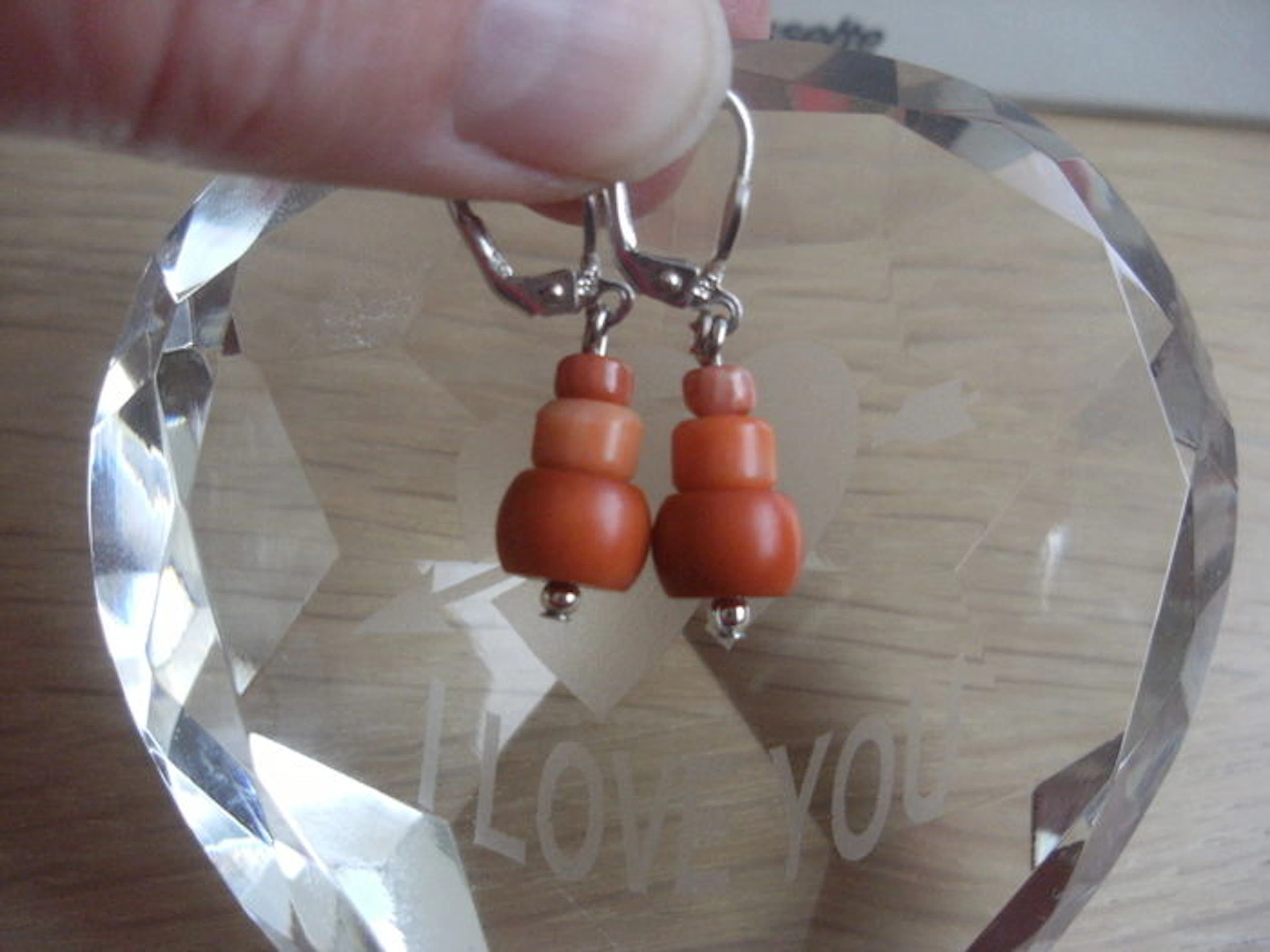 Silver earrings, featuring blood coral.