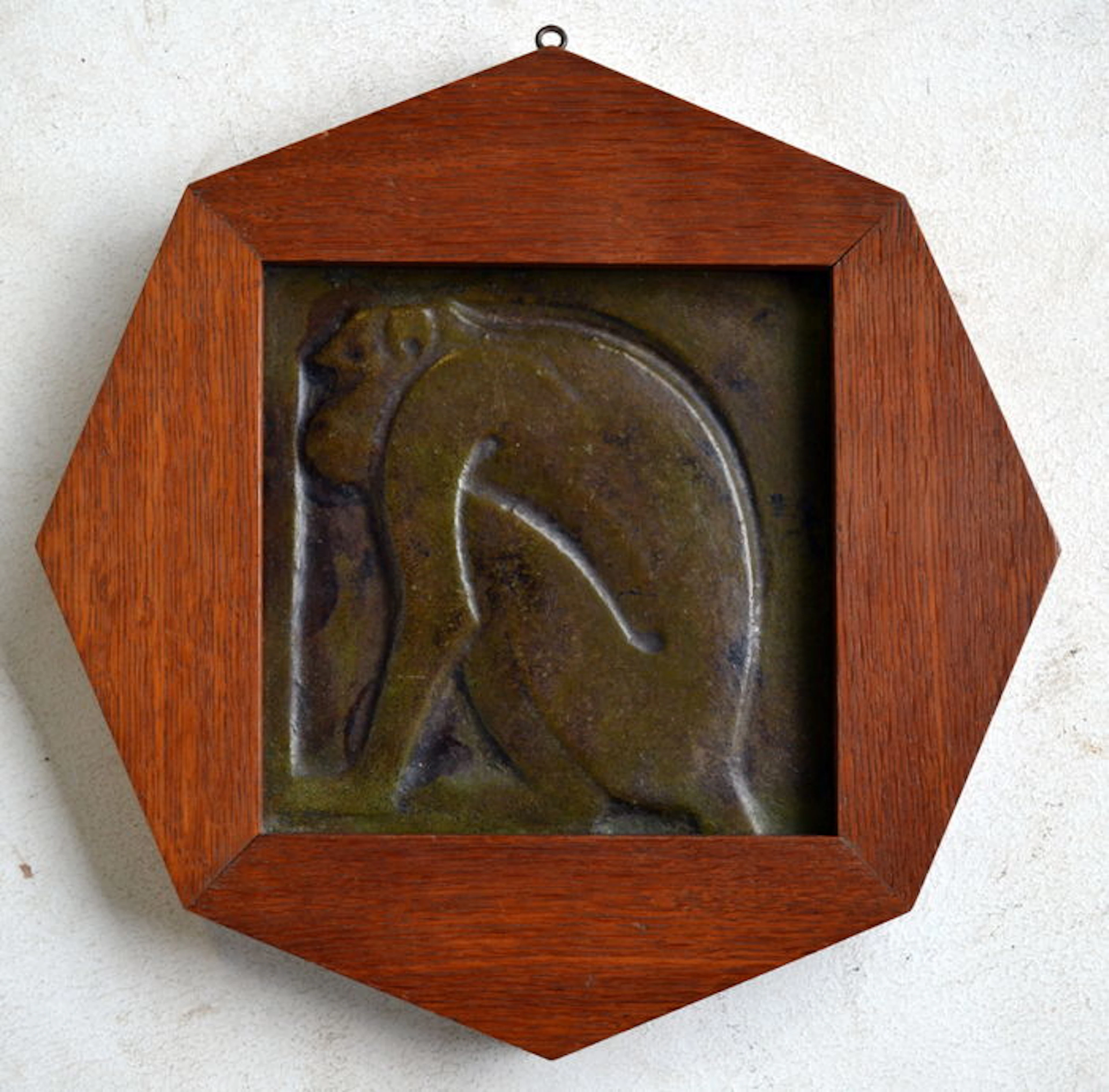 Nijmeegsche Kunststeenfabriek - antique green wall plaque with monkey representation