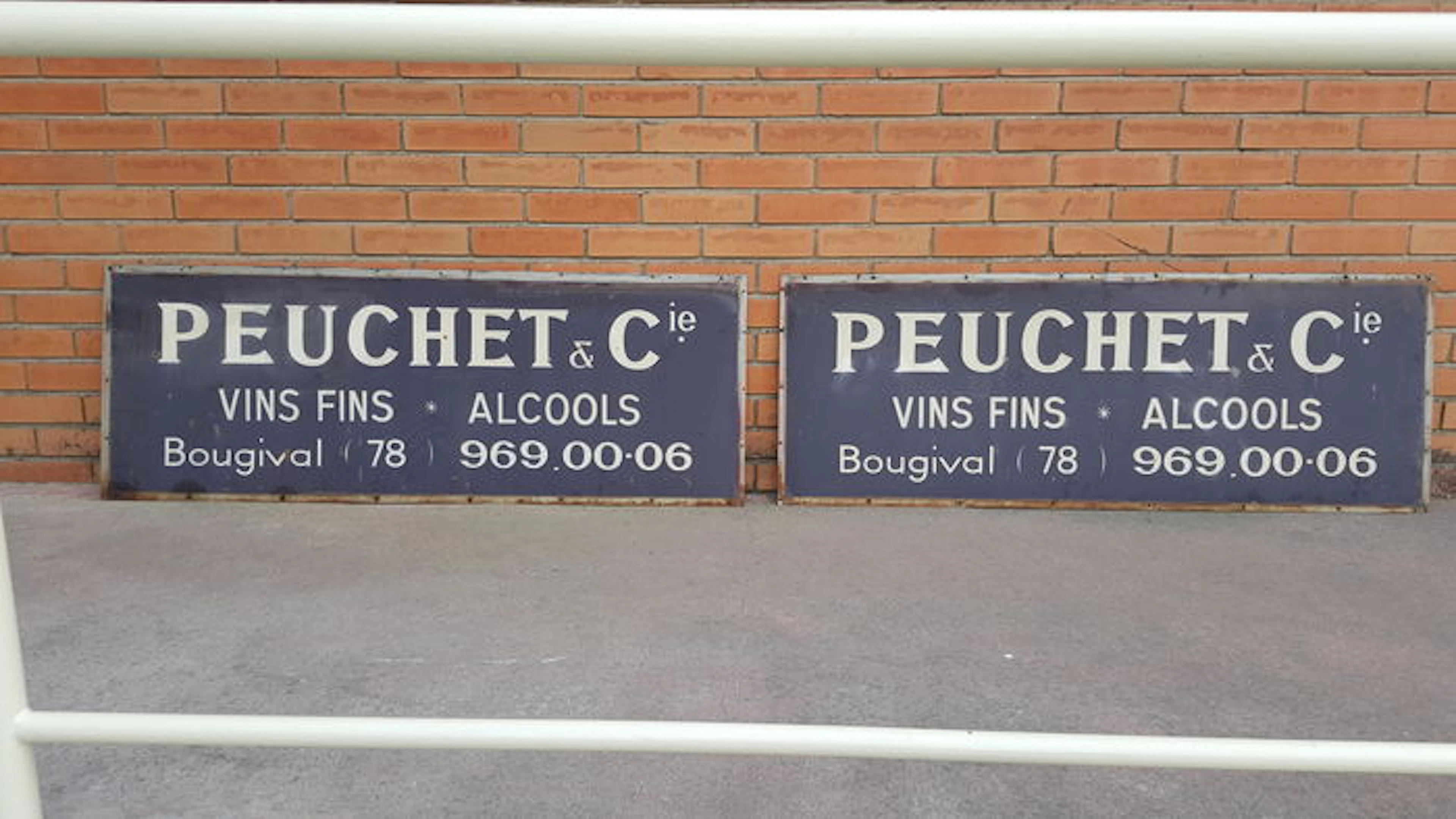 Two metallic classic cartels of the French company of wines: Peuchet and Cie. founded in 1885.