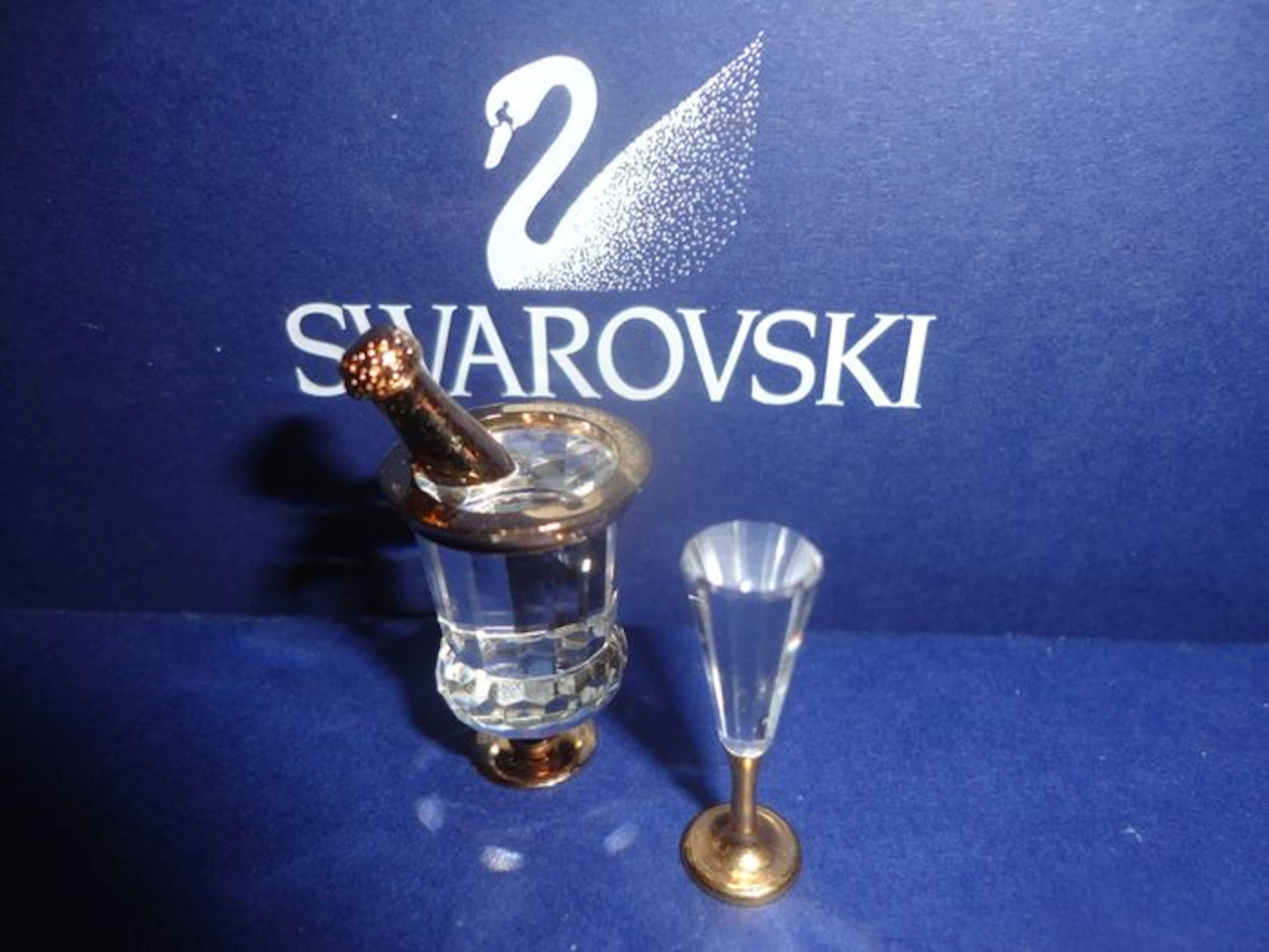 Swarovski Crystal Memories - champagne cooler - rocking horse - spinning wheel - table bell - yarn - baby bottle - antique bike - coffee pot - tie pin - inkwell with feather - piano - saxophone - pram -