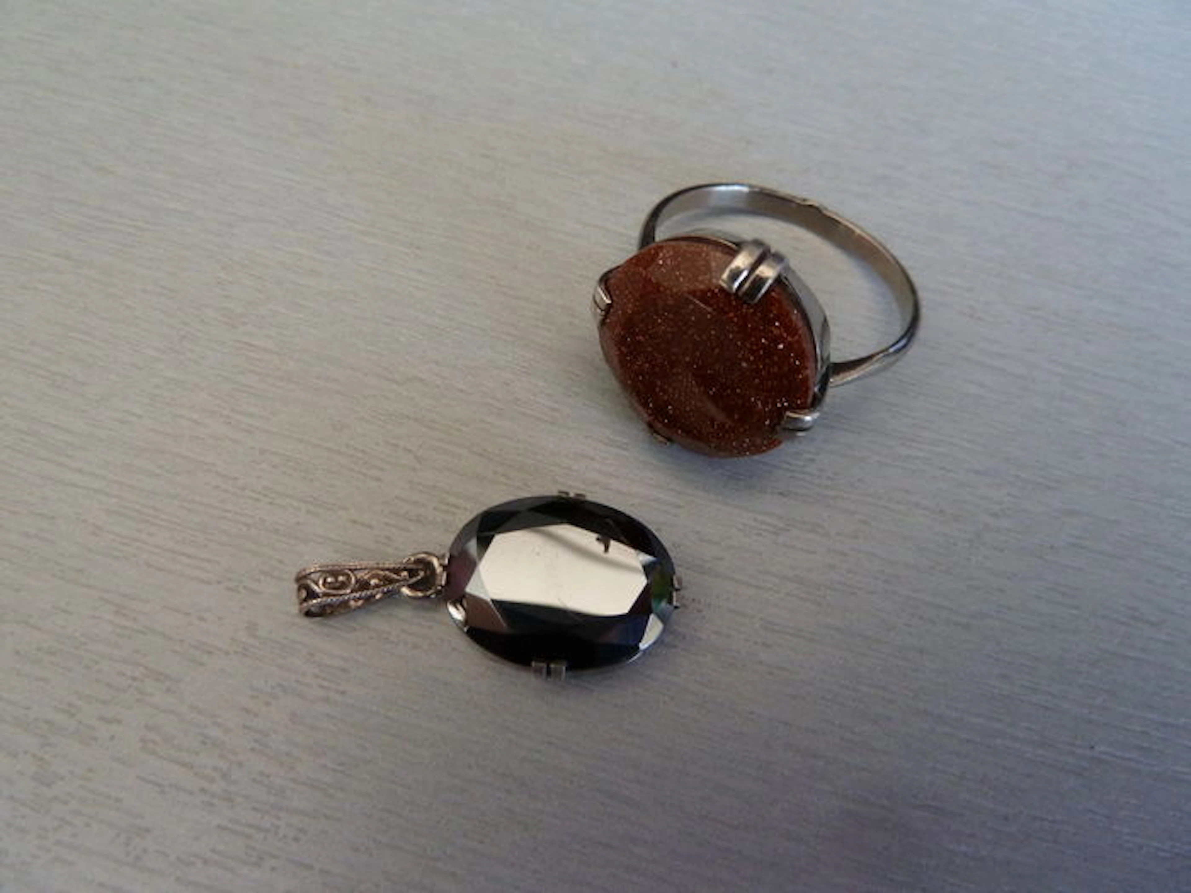 A hallmarked silver ring set with lepidolite – Hallmarked silver pendant set with hematite