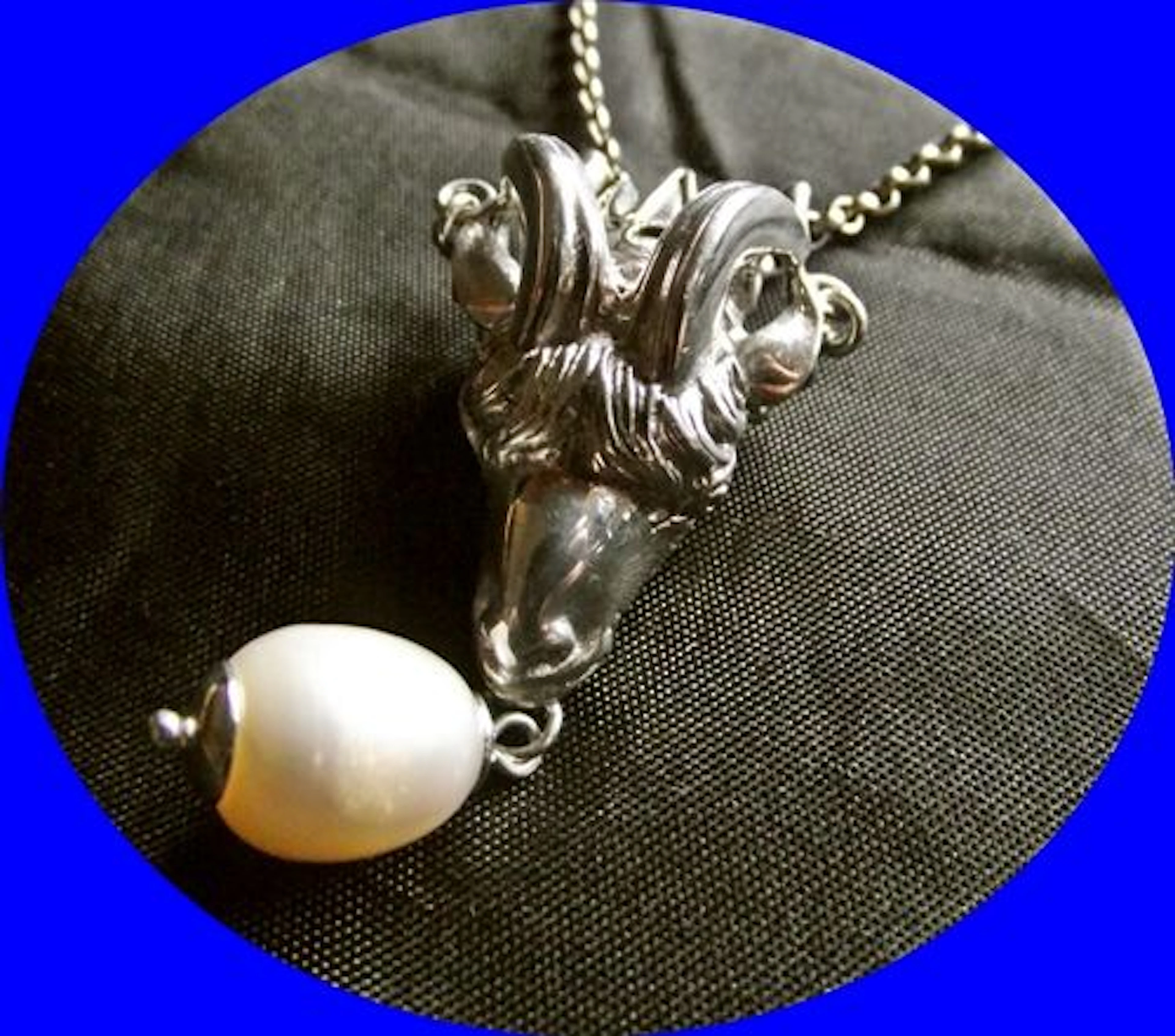 A high quality silver rams head pendant stamped 935
