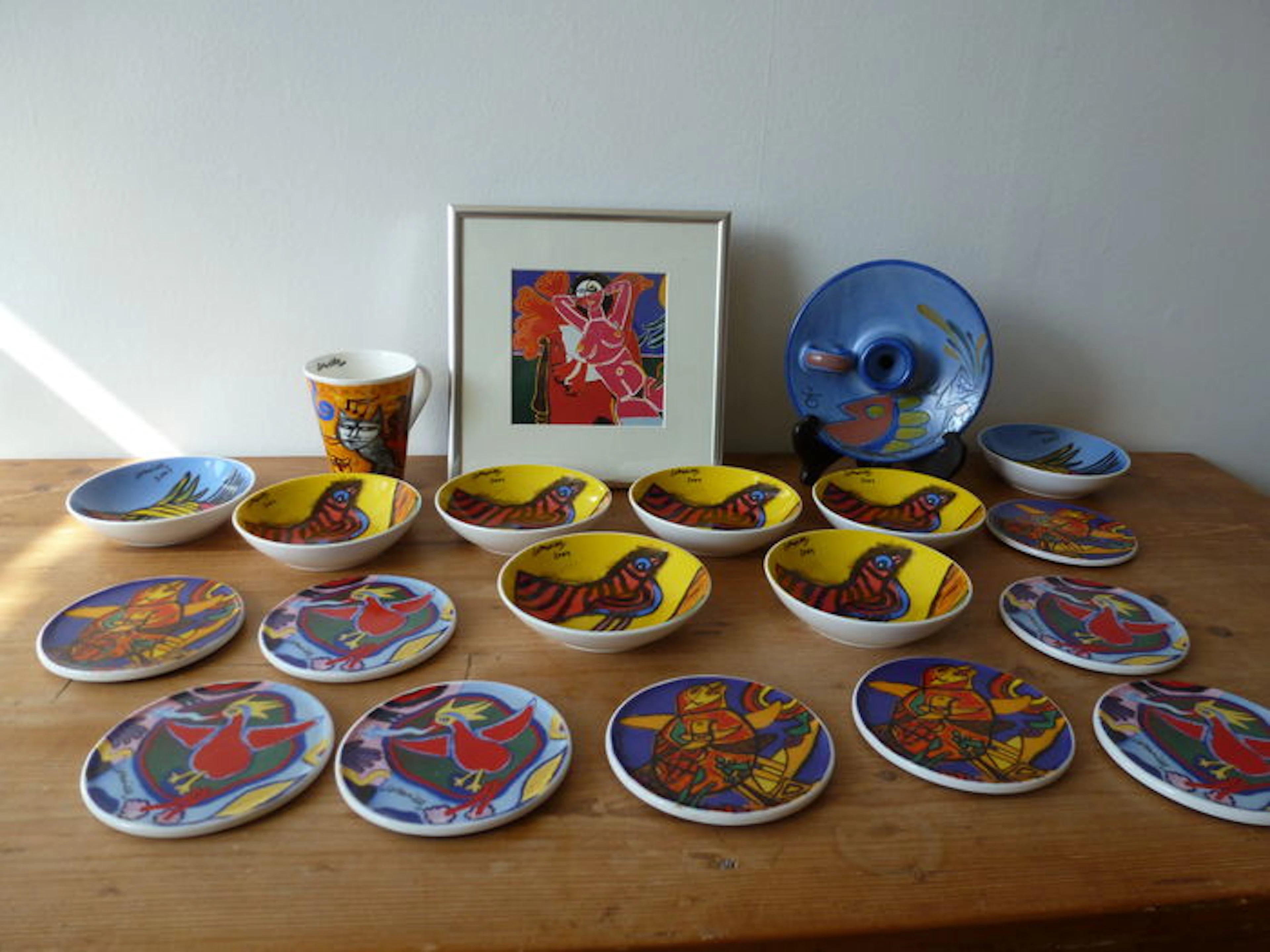 Corneille - coasters, dishes, cup, candlestick and a framed image.