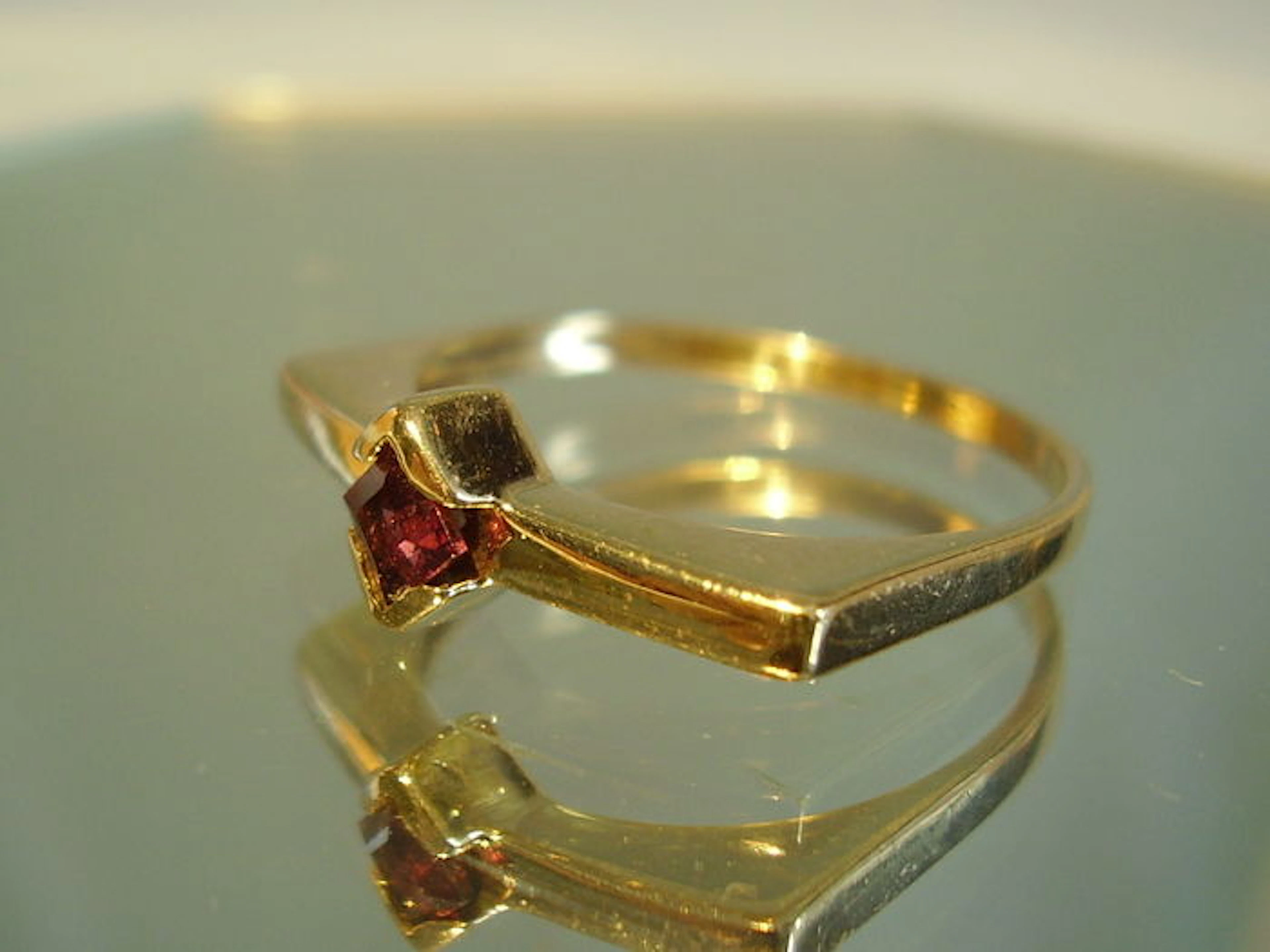Golden design ring with Rhodolith-Karree stone