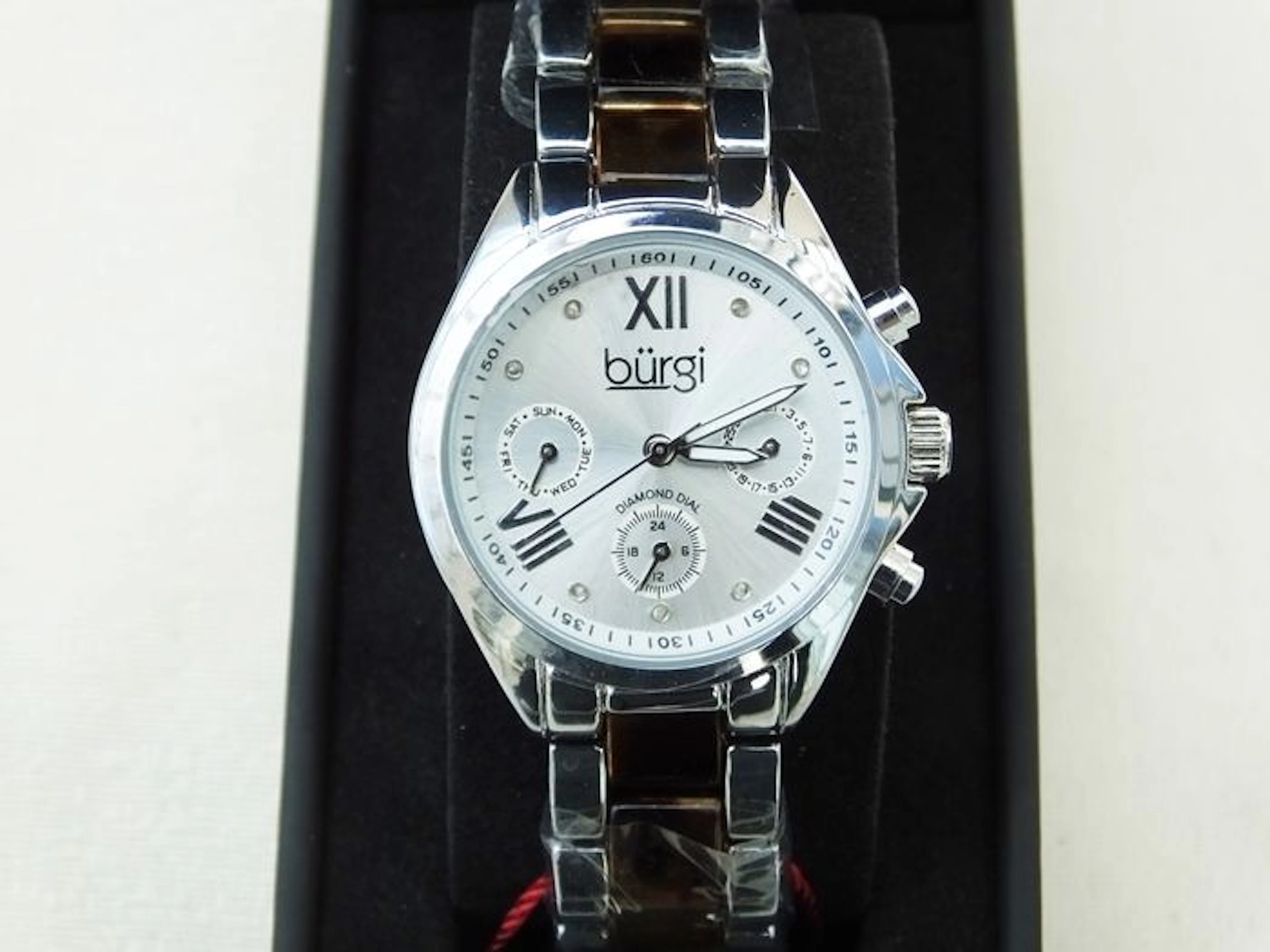Burgi women’s wristwatch with beautiful strap.