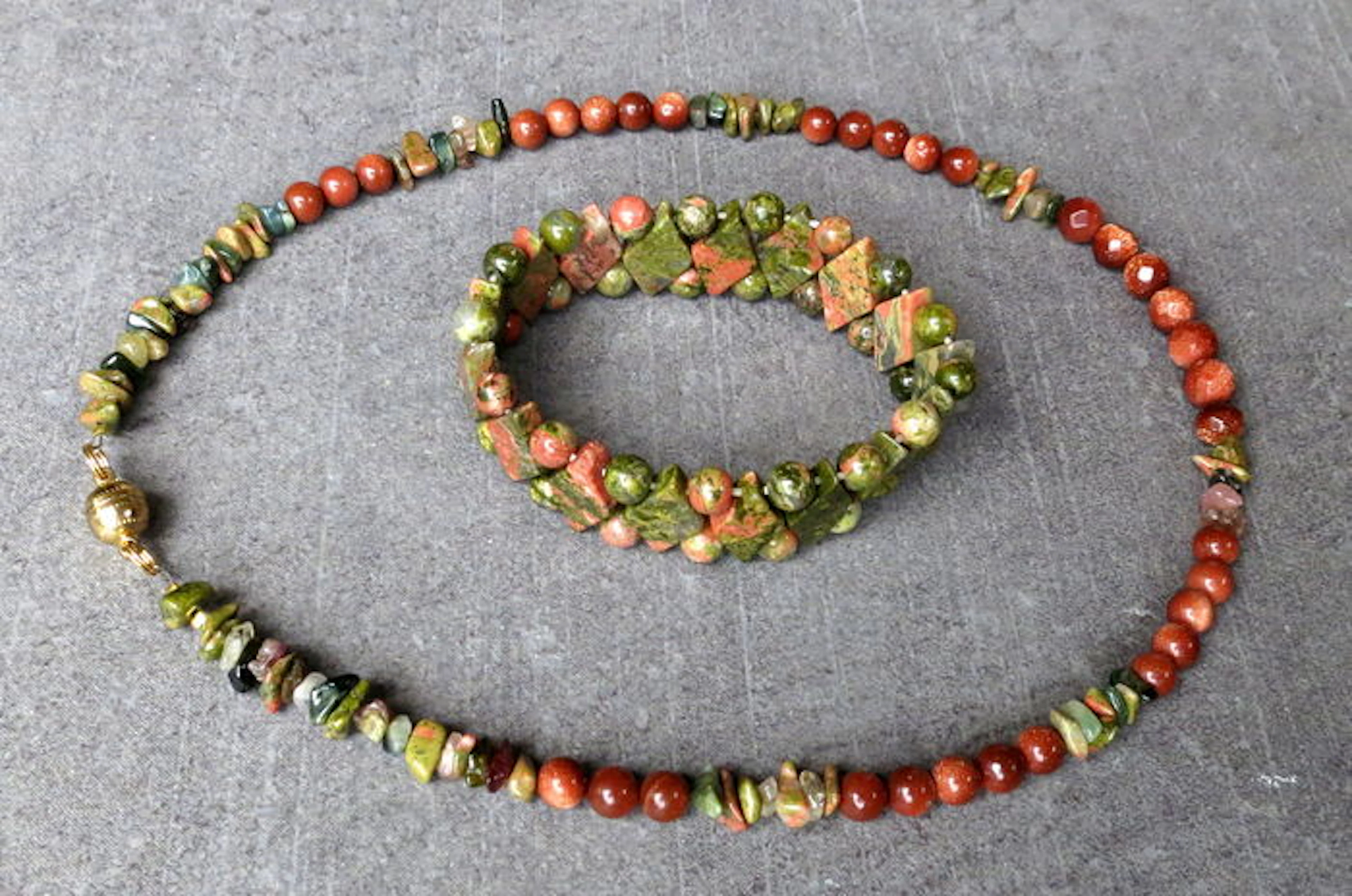 Necklace and bracelet made of unakite and red sun sitara.