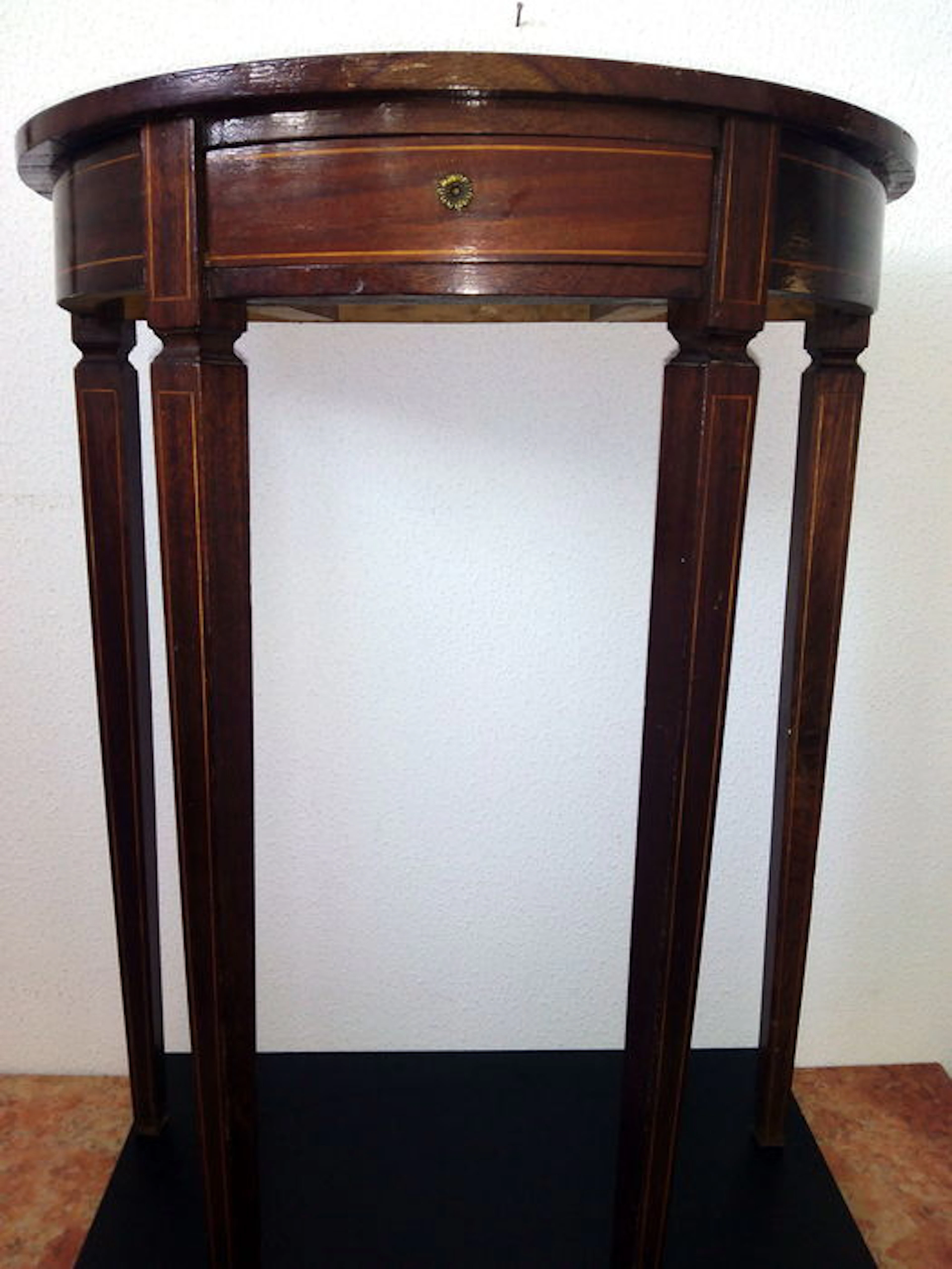 A mahogany demi lune console table with drawer, circa 1960