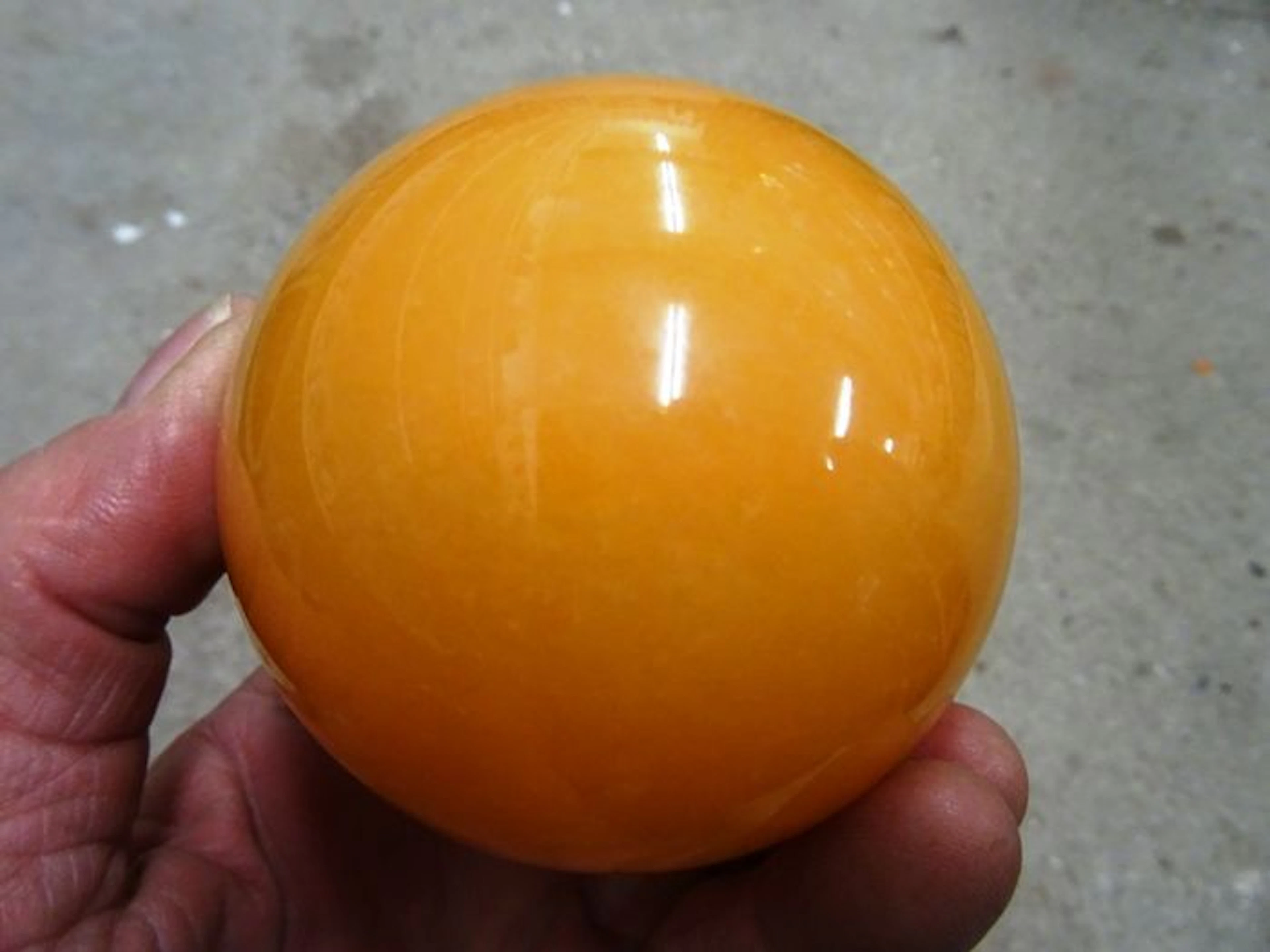 Orange calcite sphere - 8,2cm - 788gm