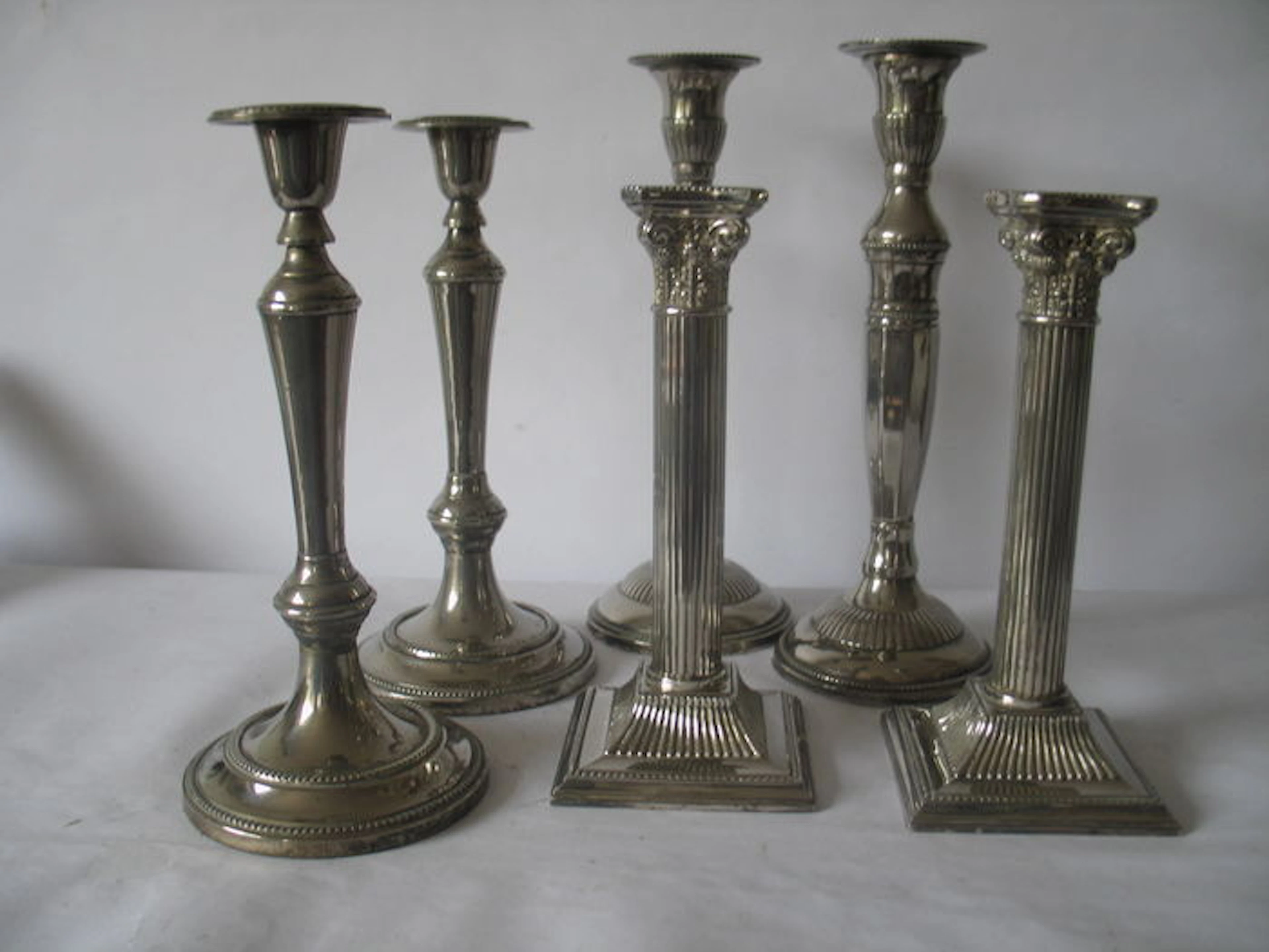 A lot with 6 pieces (3 sets) silver plated candlesticks, England, the Netherlands, 20th century