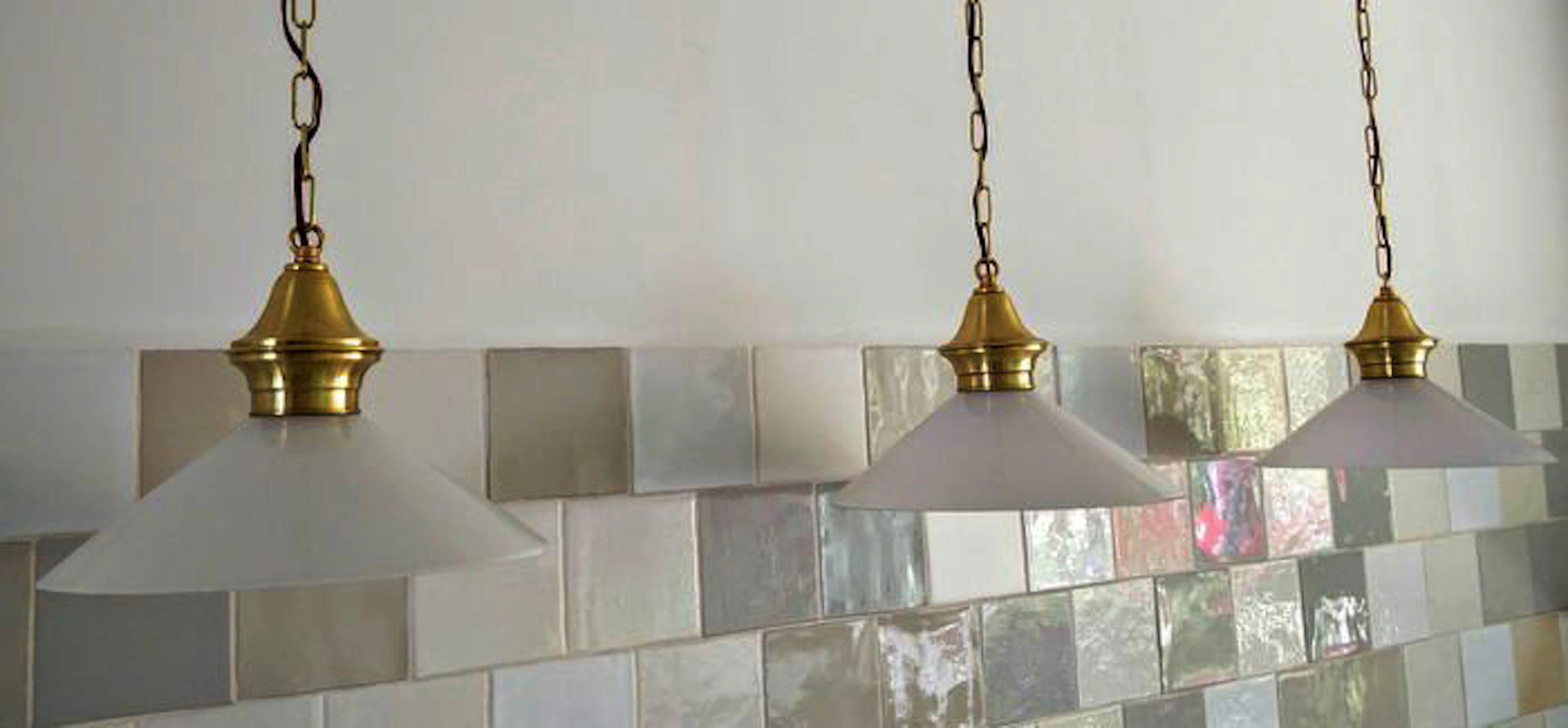 Three kitchen lamps with milk glass lamp shades and brass fixtures - early 21st century