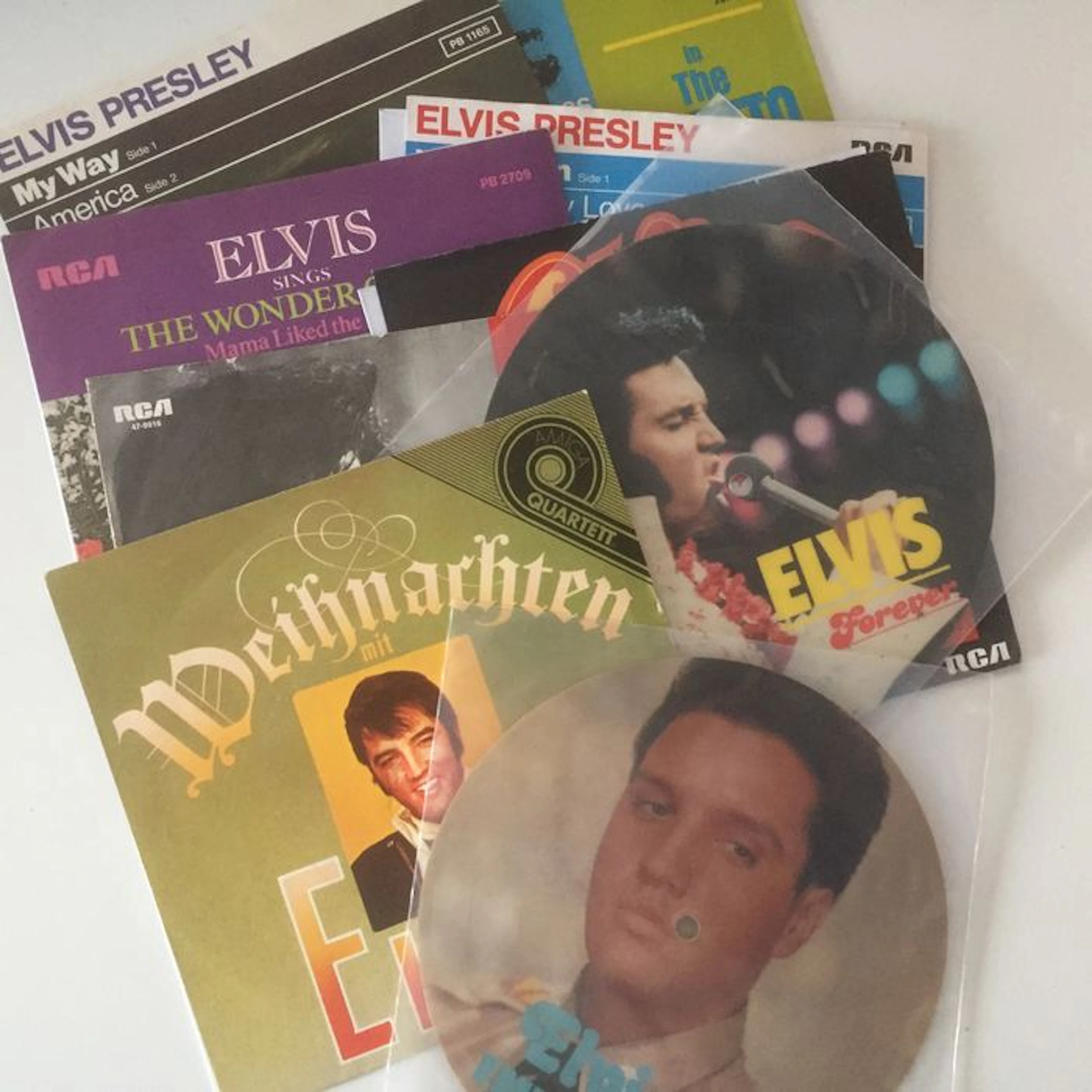 Elvis Presley, beautiful lot of 9 picture sleeve and picture disc seven inch singles