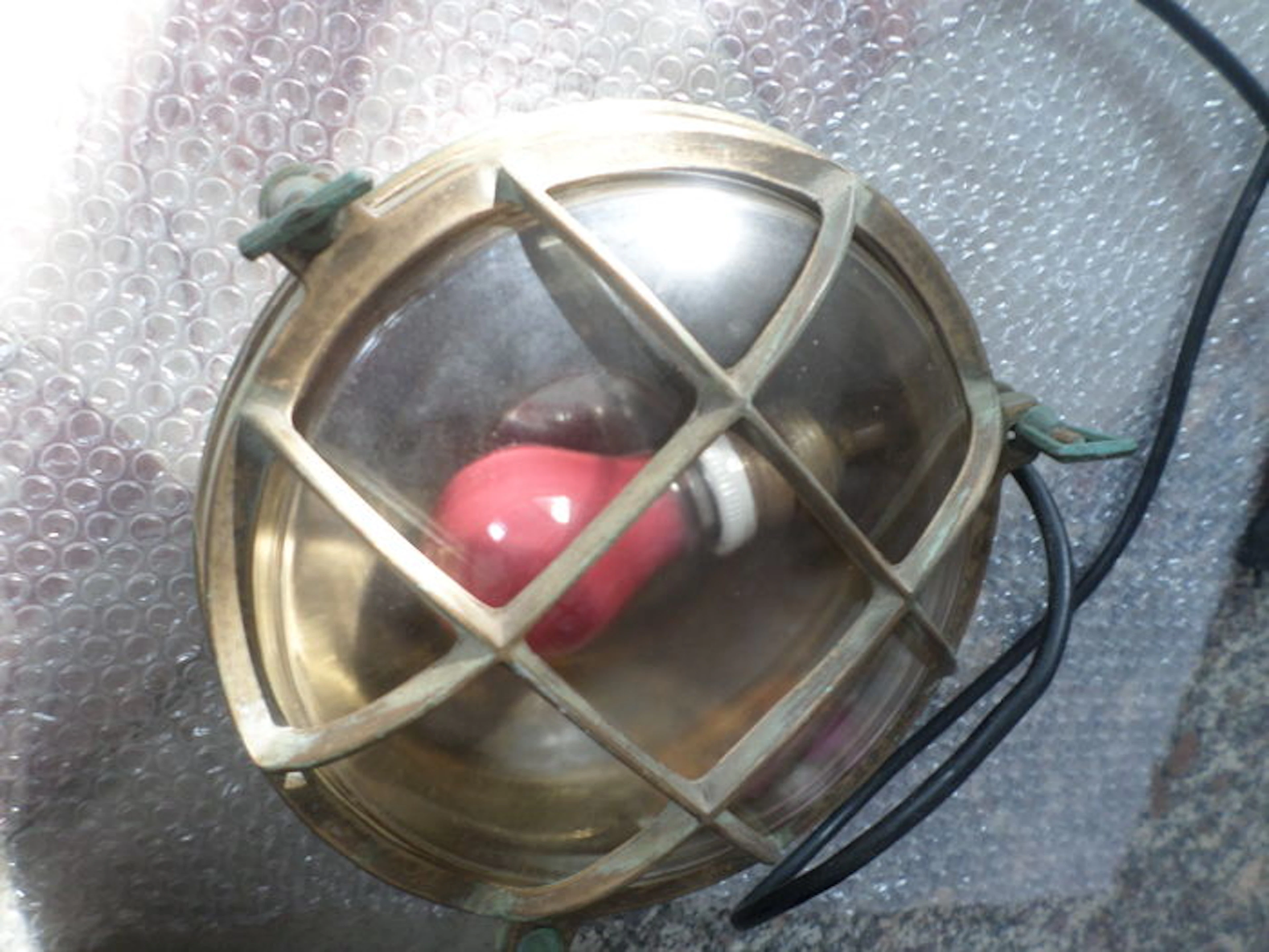 Unknown designer—original brass porthole-shaped ship's lighting