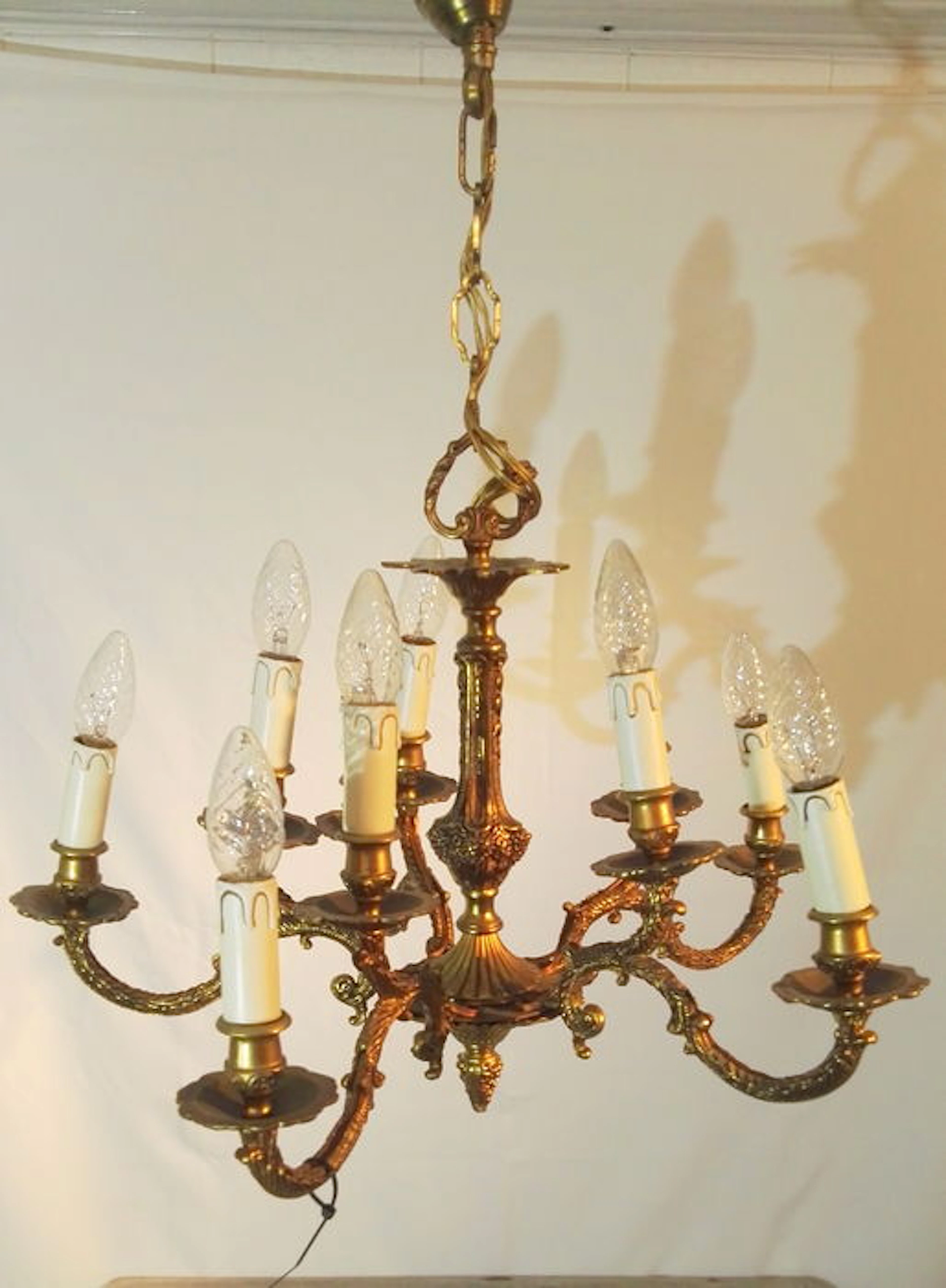 A bronze 10-arm chandelier