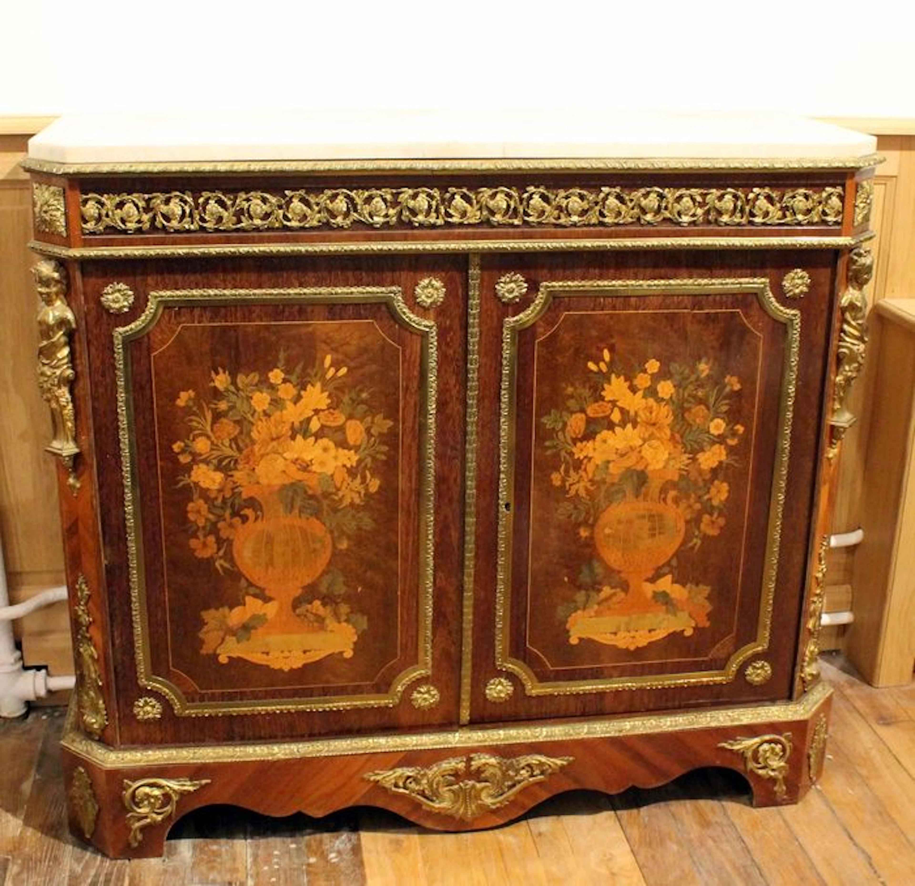 A Napoleon III cabinet with gilded bronze, amaranth