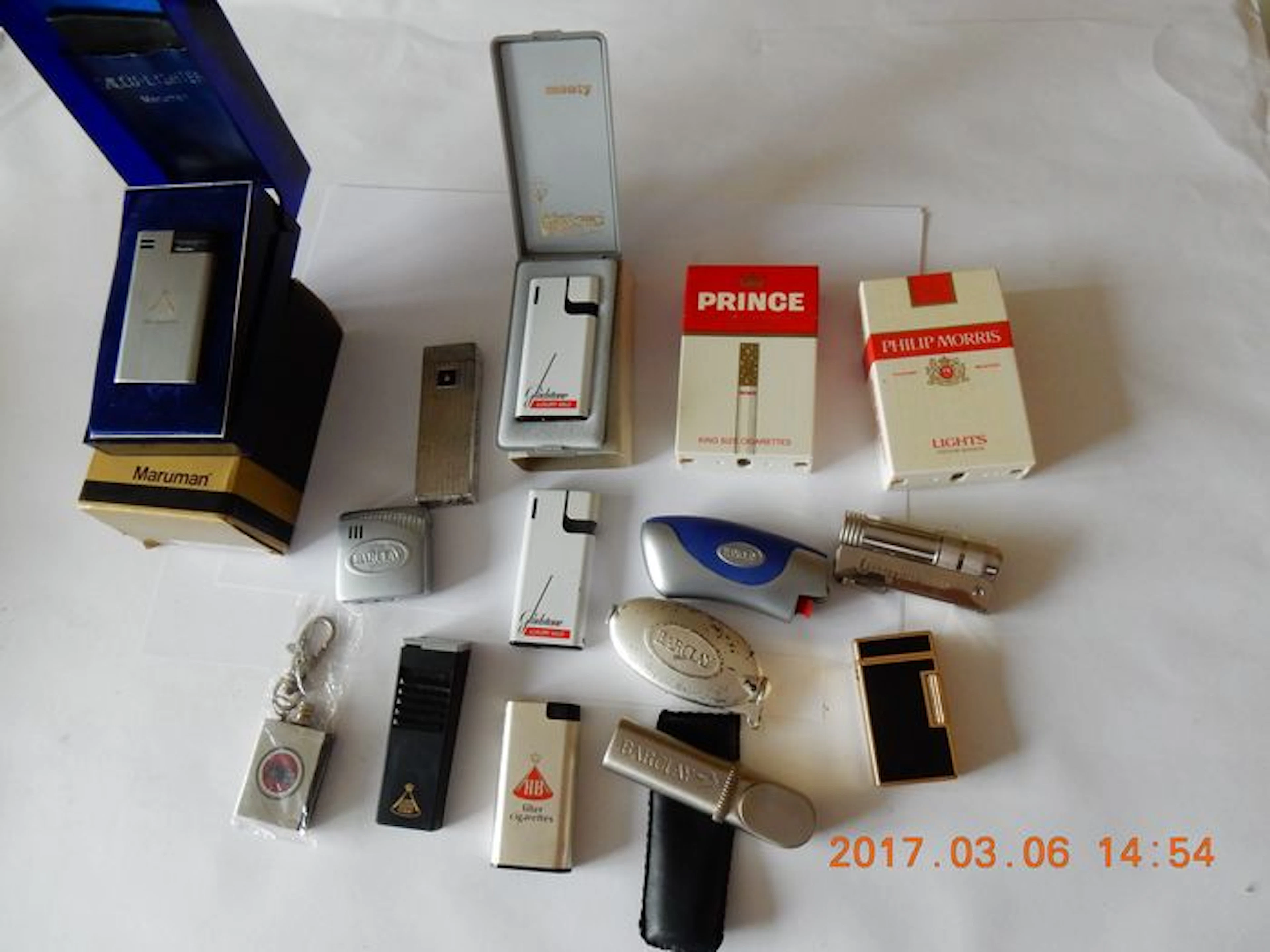 Collection of 15 refillable lighters of various cigarette brands