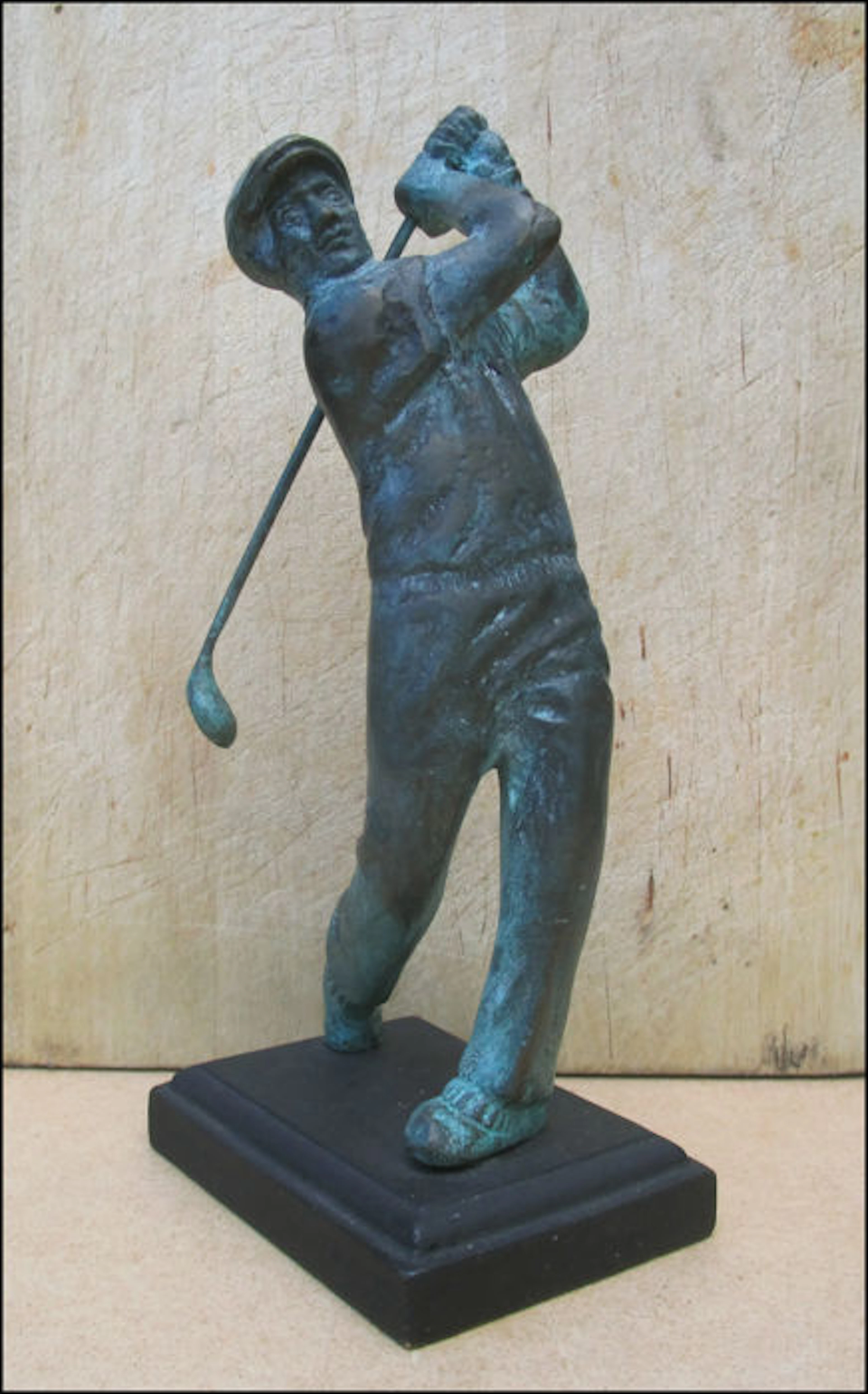 Maker unknown - graceful brass sculpture of a golf player with natural patina