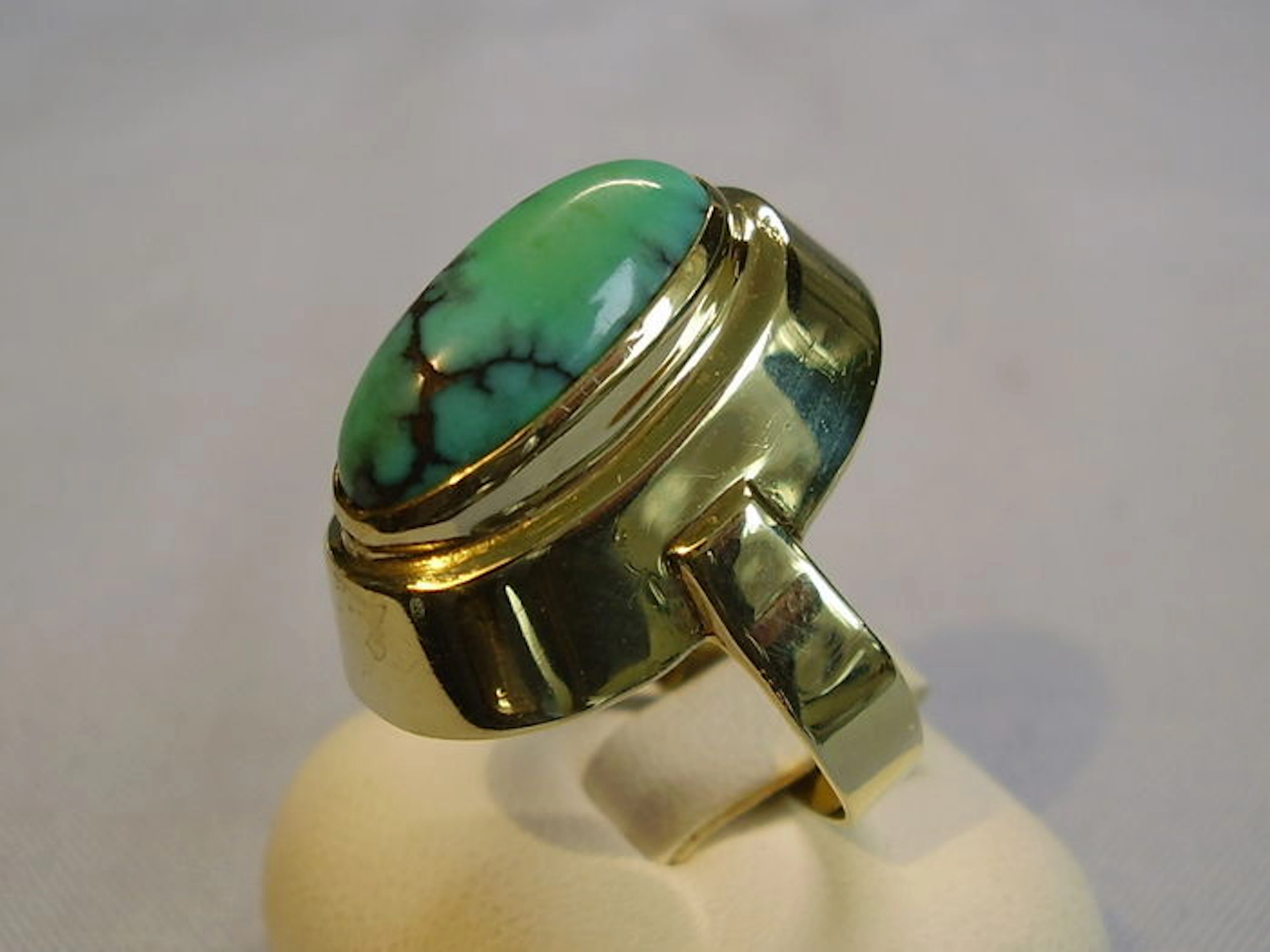 Large, gold ring with genuine natural turquoise