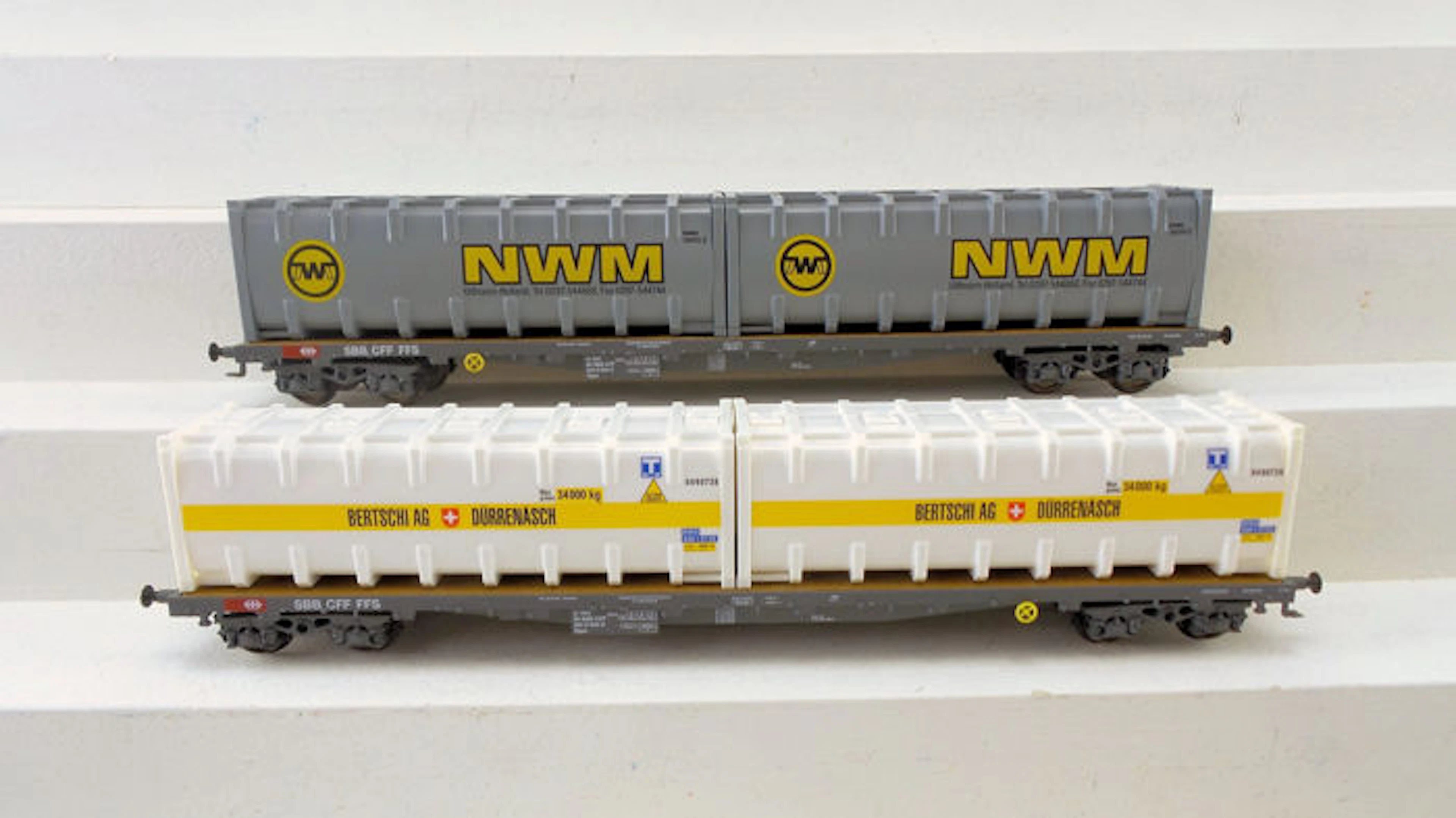 HAG H0 - 356 - Two four-axle container wagons Sgss with containers of "Bertschi AG" and "NWM" of the SBB