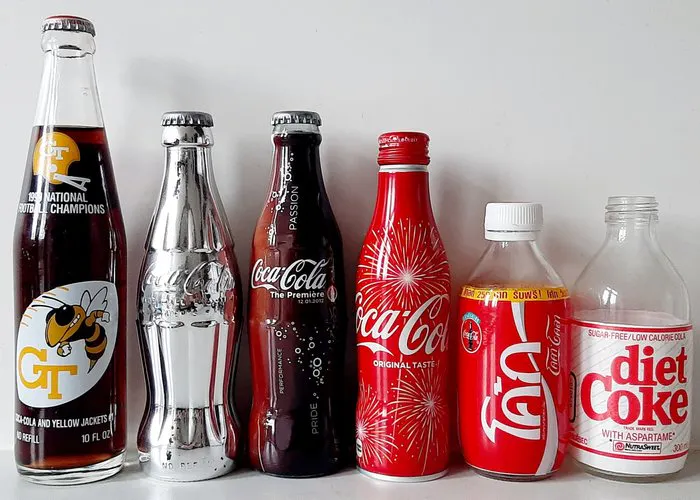 Branded merchandise collection - Coca Cola bottles silver... | Barnebys