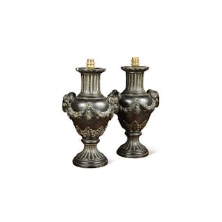 A pair of black basalt vase lamps