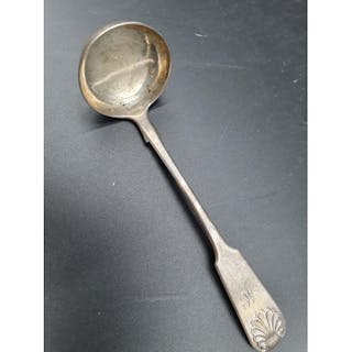 A William IV silver Sauce Ladle fiddle and shell pattern eng...