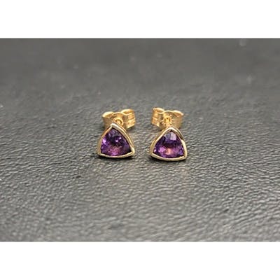 PAIR OF AMETHYST STUD EARRINGS in nine carat gold, the trill...