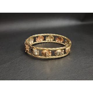 EIGHTEEN CARAT TWO TONE GOLD ELEPHANT DECORATED BANGLE with ...
