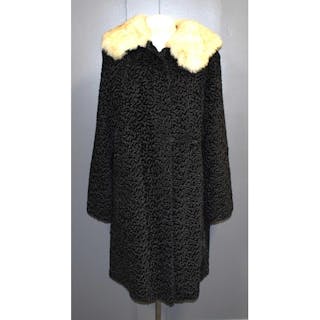 A vintage Astragan coat with fur collar.