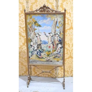 A late 19th century embroidered firescreen, the painted grou...
