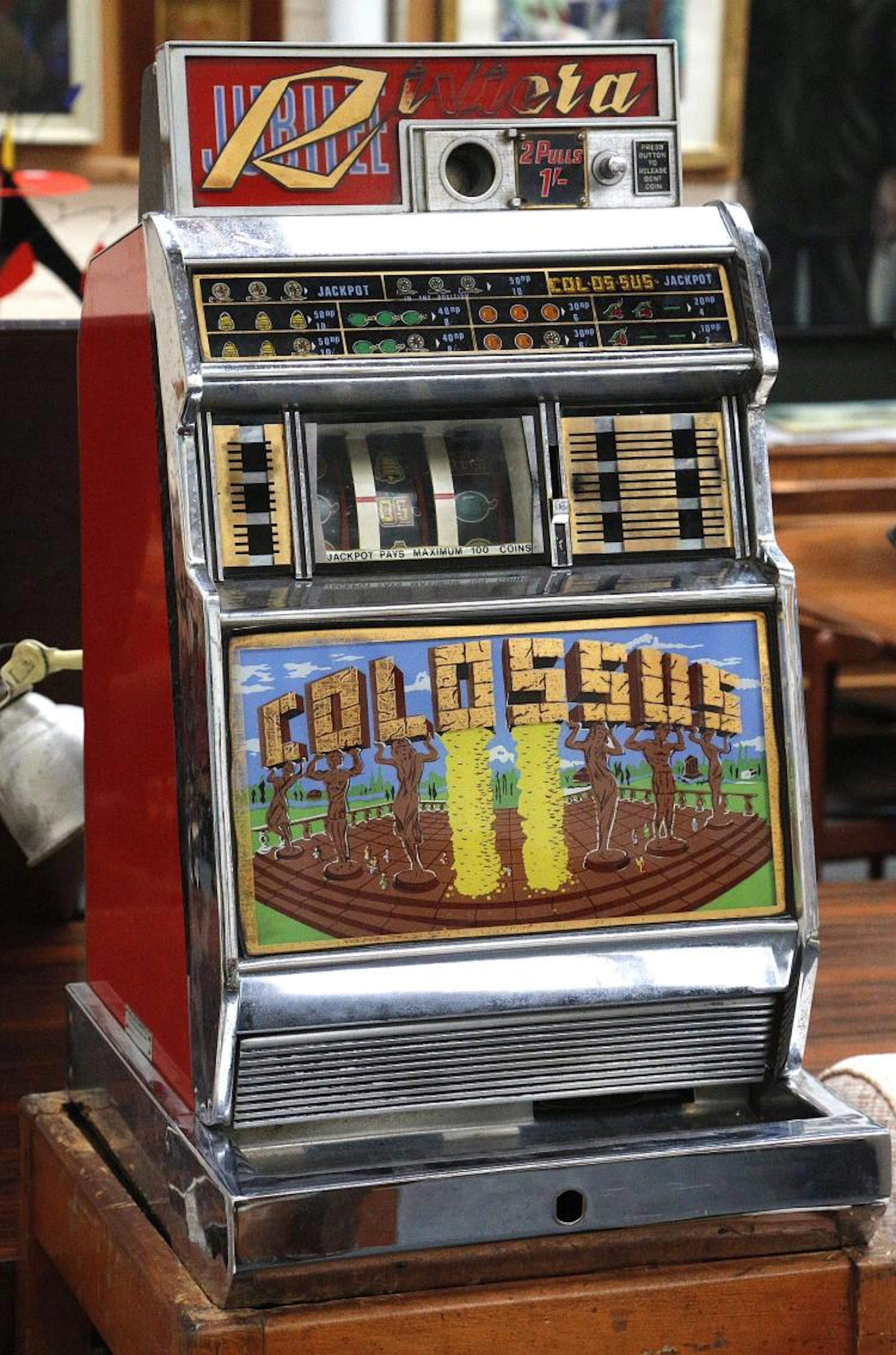 A 1960'S COLOSSUS RIVIERA ONE ARMED BANDIT FRUIT MACHINE.