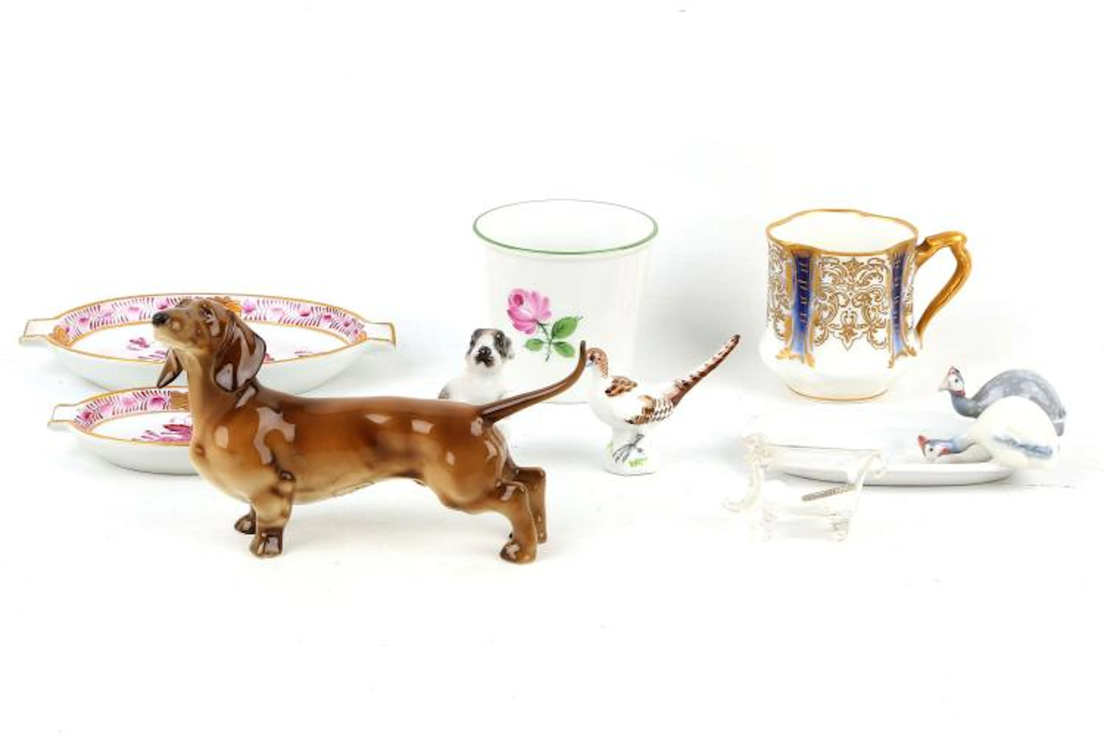 A German Hutschenreuther porcelain lustre glazed model of a dog