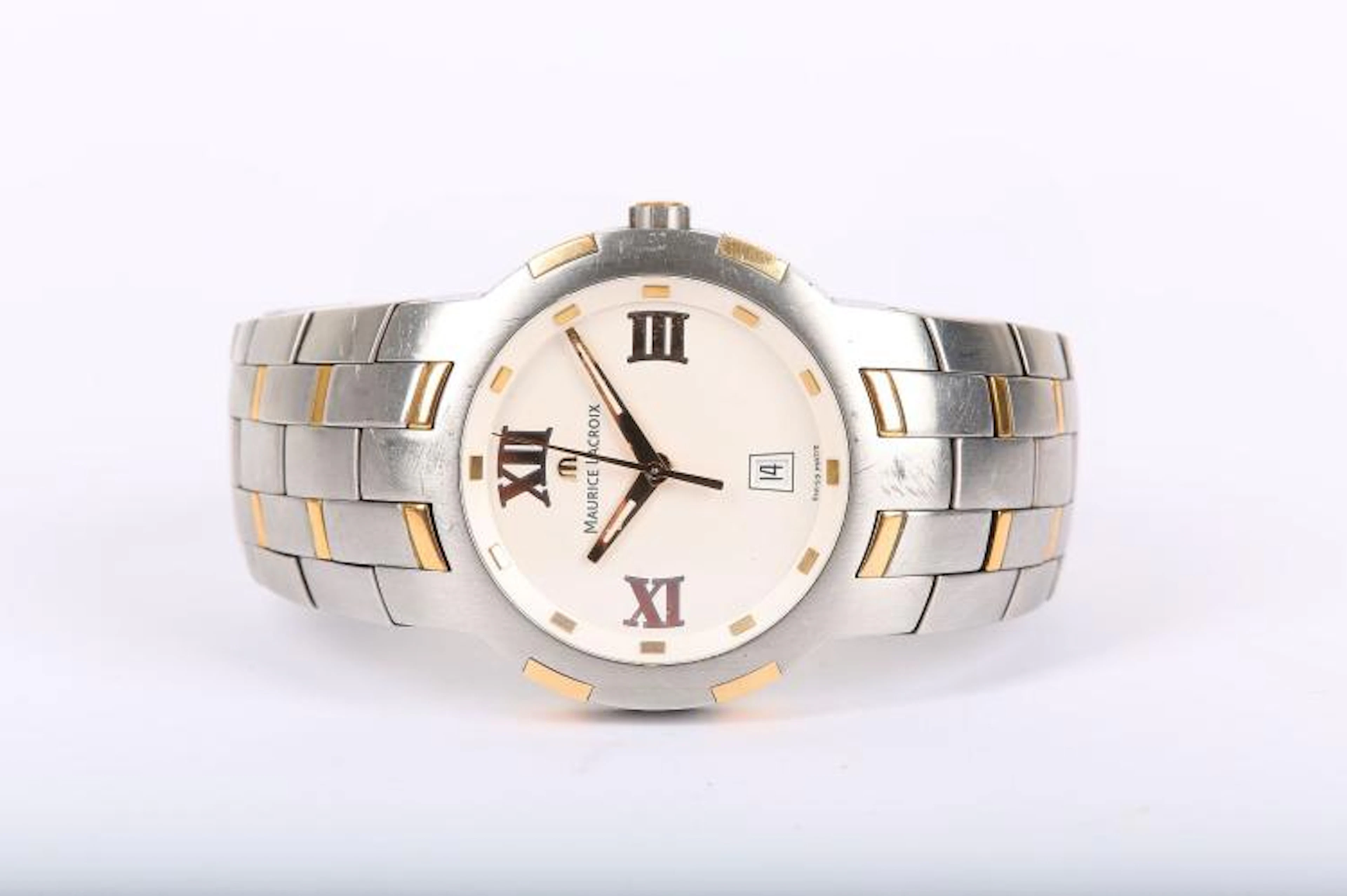 MAURICE LACROIX. A gents stainless steel and 18k gold calendar bracelet