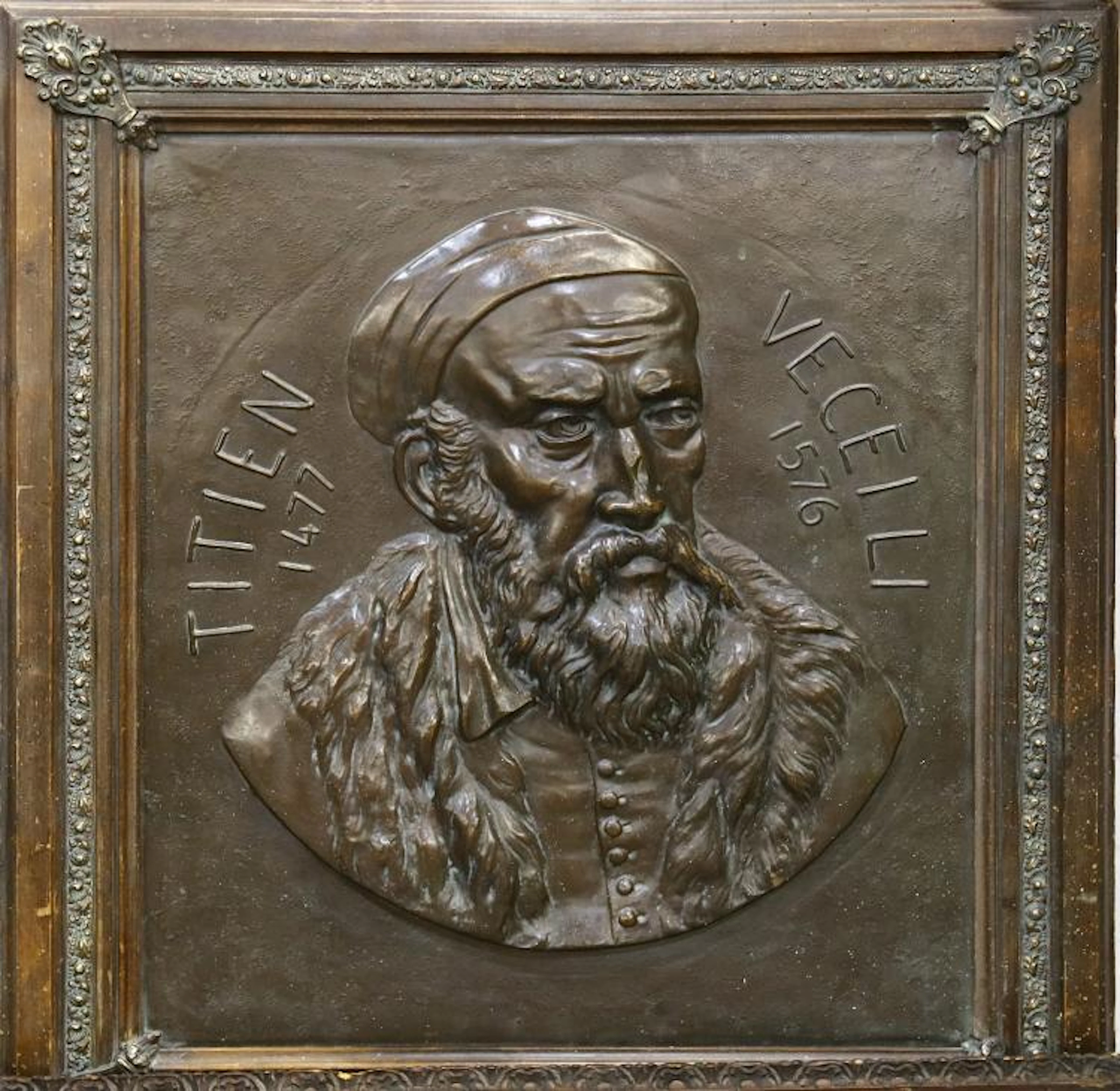 A 19th Century bronzed deep relief portrait of a Titian, set into