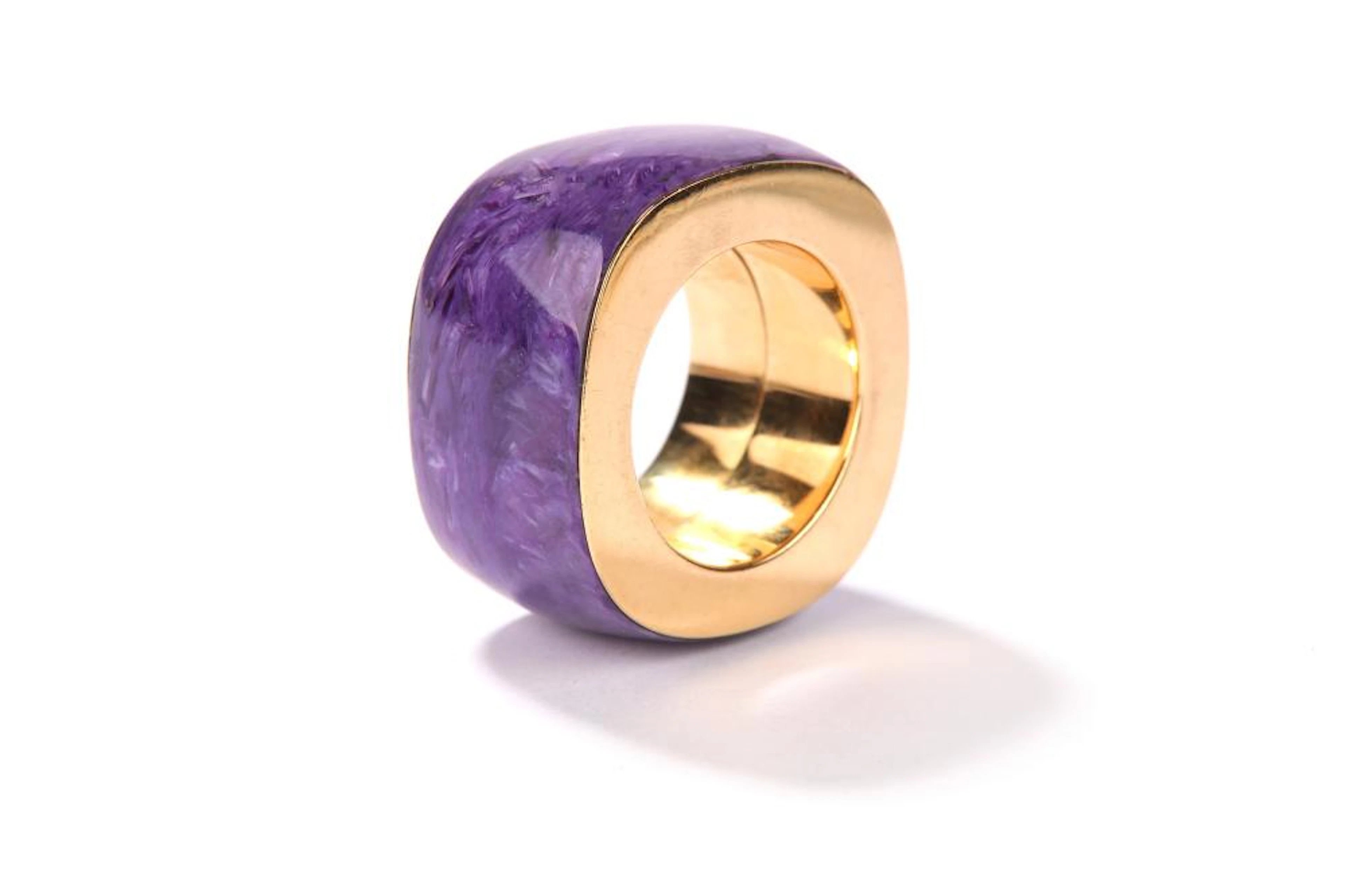 A charoite dress ring The wide polished charoite band of square outline