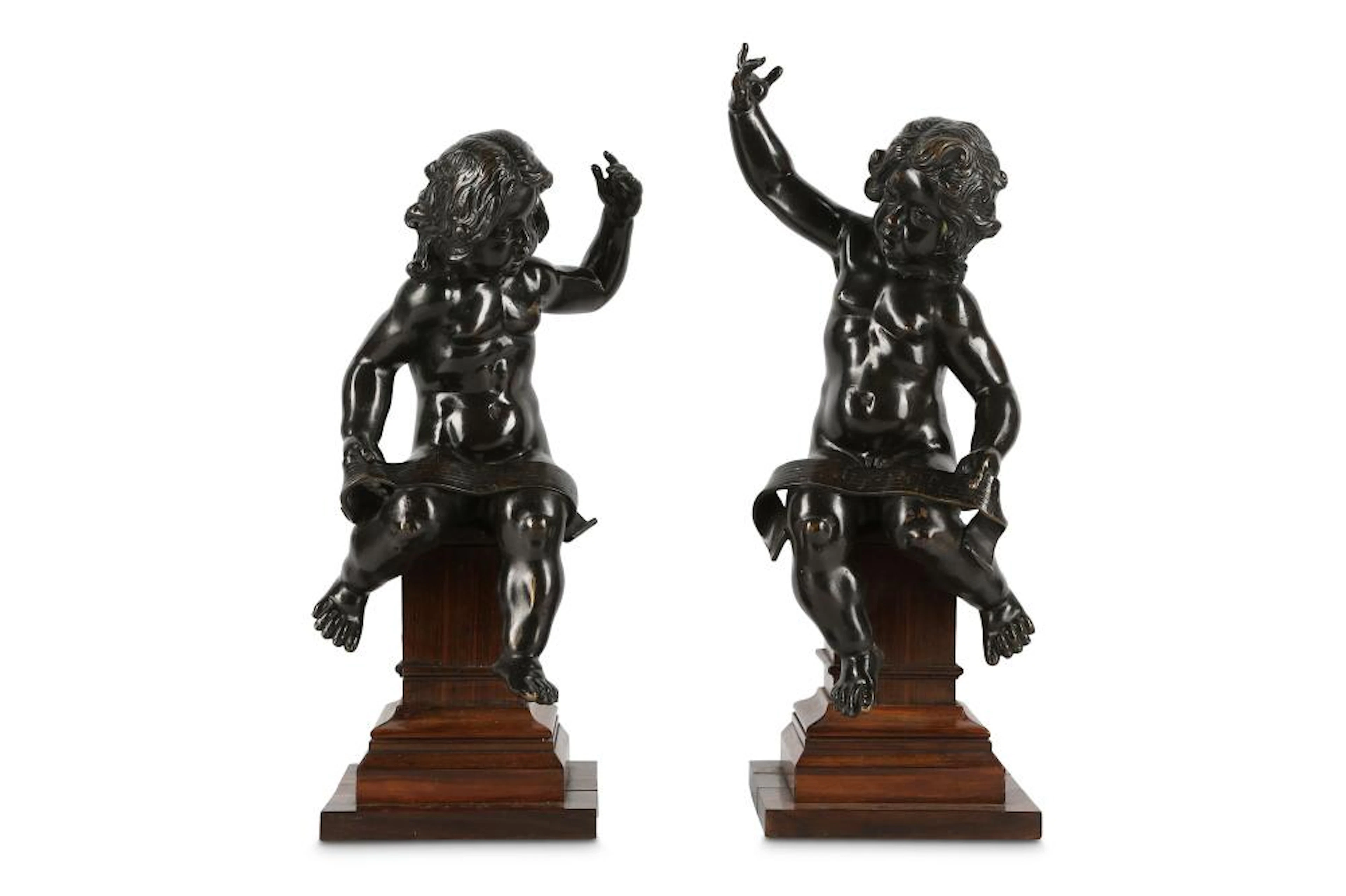 A PAIR OF BRONZE PUTTI IN THE MANNER OF FERDINANDO TACCA (ITALIAN