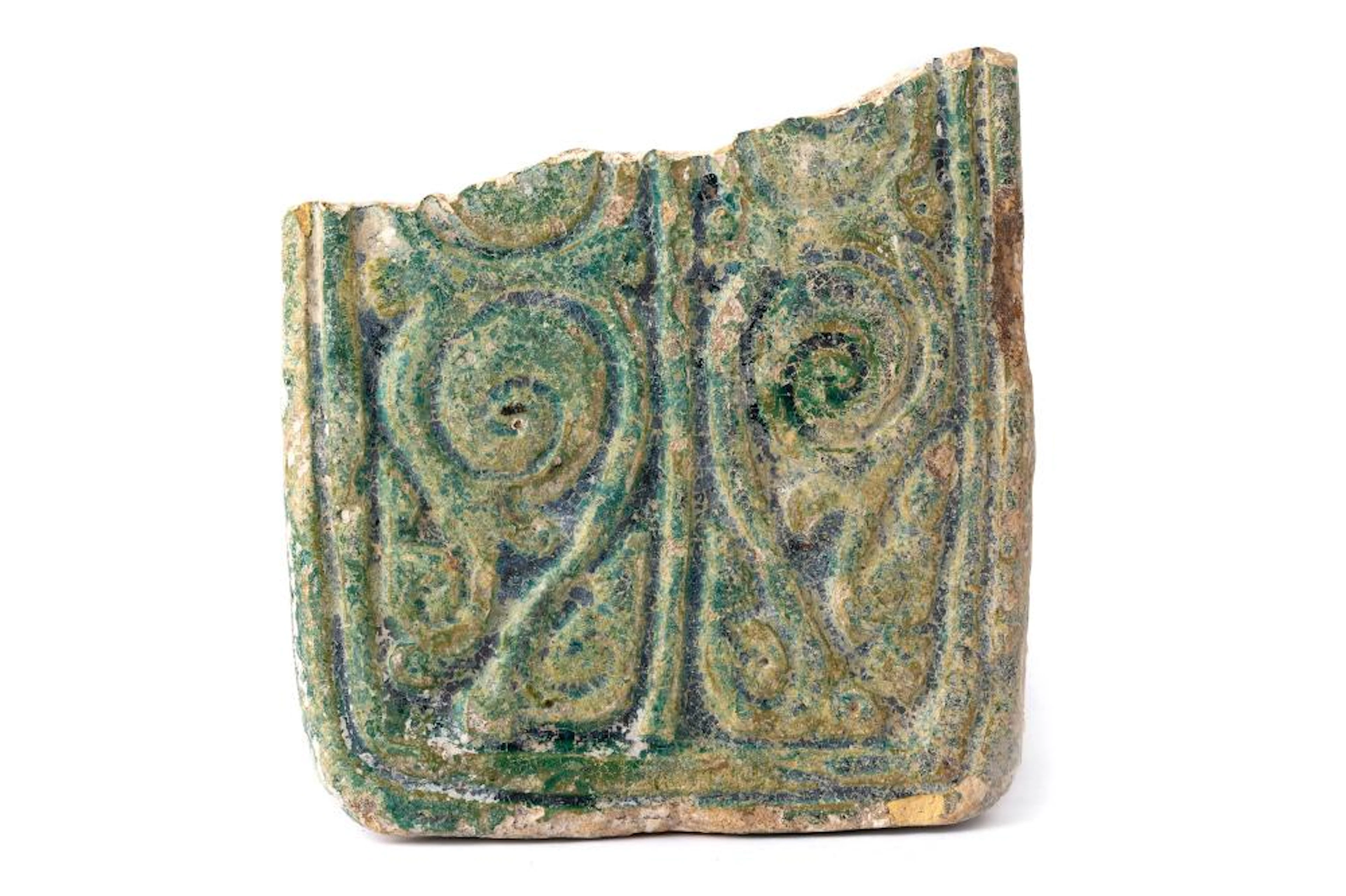 A FRAGMENTARY GREEN-GLAZED POTTERY TILE WITH BIRDS AND VEGETAL ARABESQUE