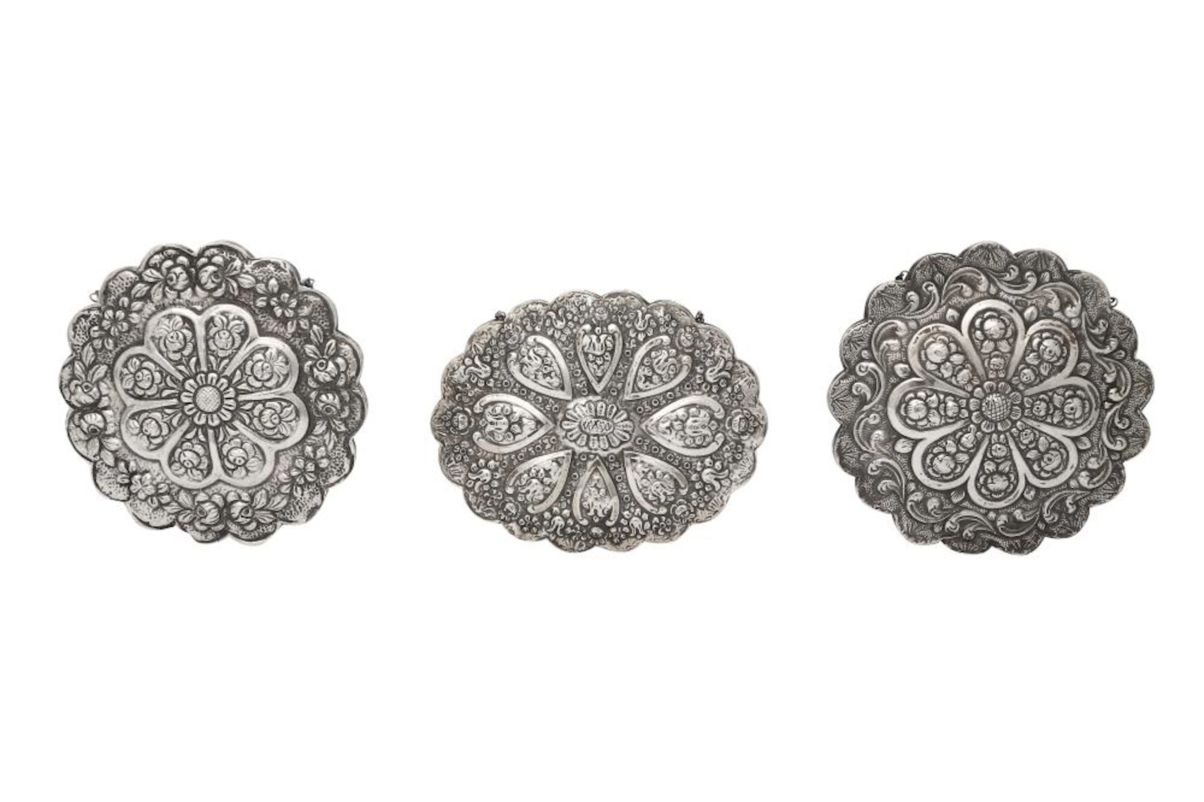 THREE TURKISH REPOUSSÉ SILVER-FOILED HANGING MIRRORS Turkey