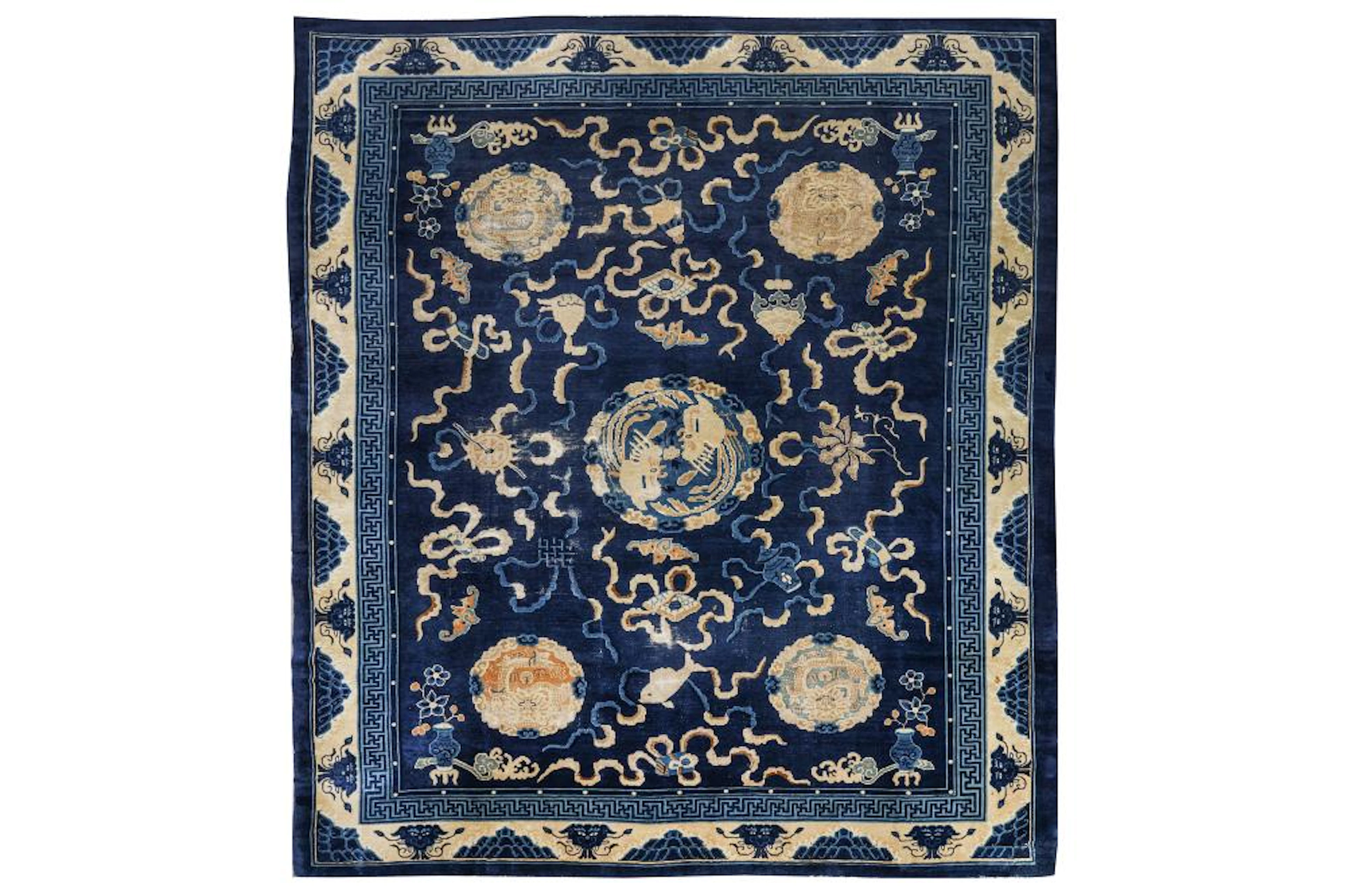 AN ANTIQUE CHINESE CARPET