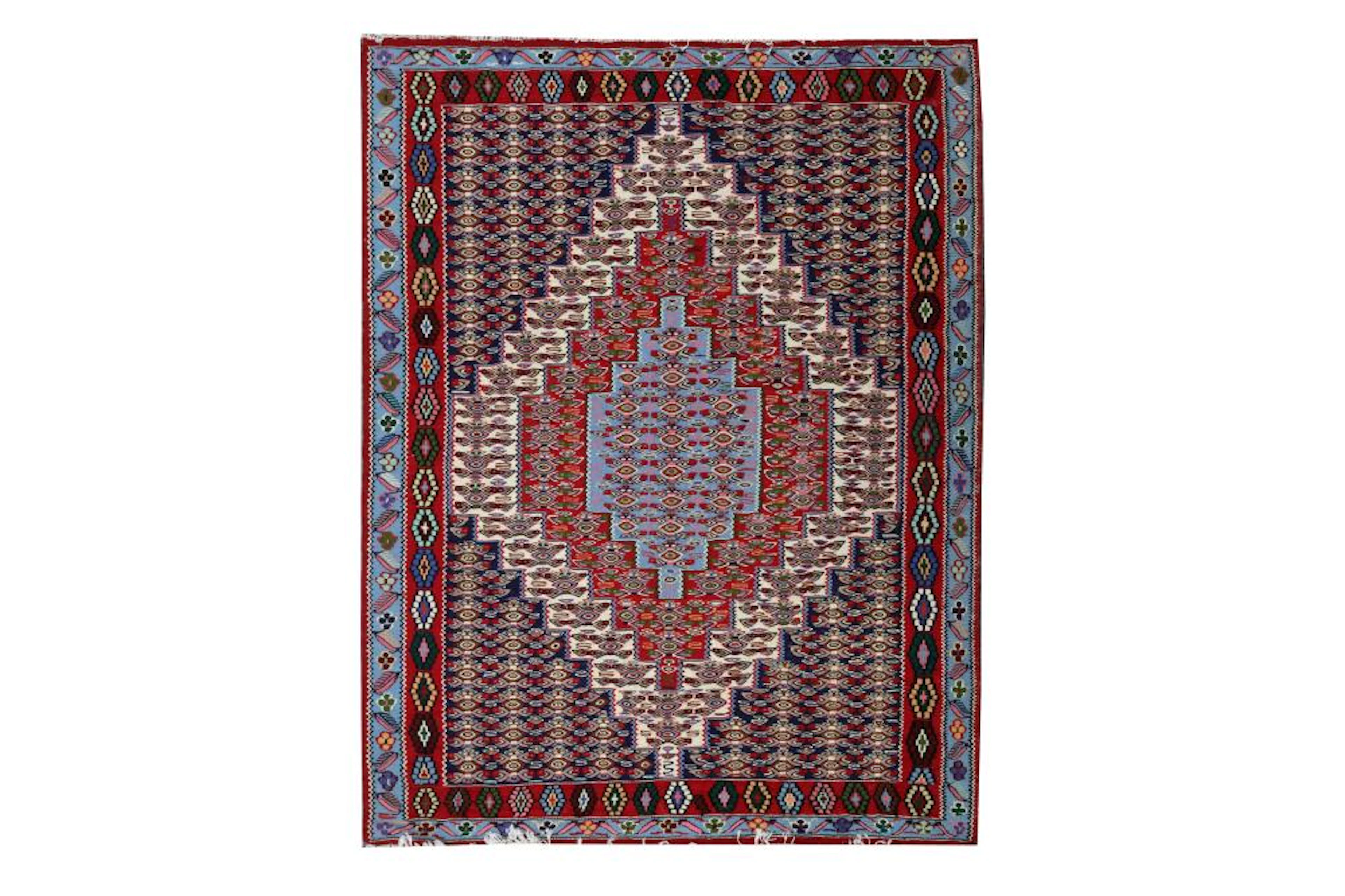 A SENNEH KILIM RUG, WEST PERSIA