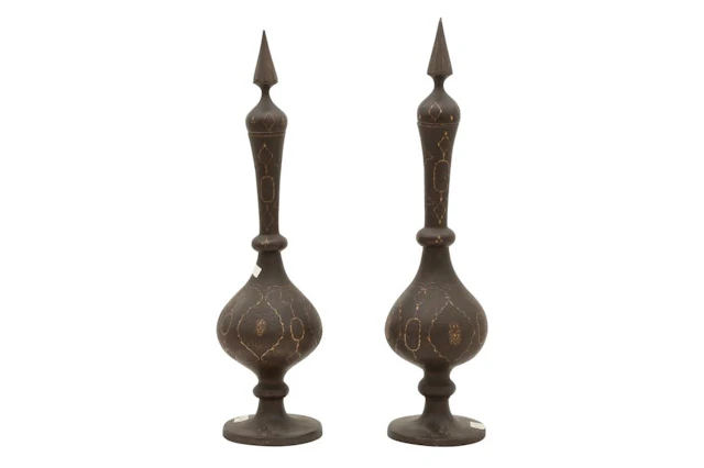 A NEAR PAIR OF QAJAR GOLD-DAMASCENED STEEL BOTTLES WITH STOPPERS