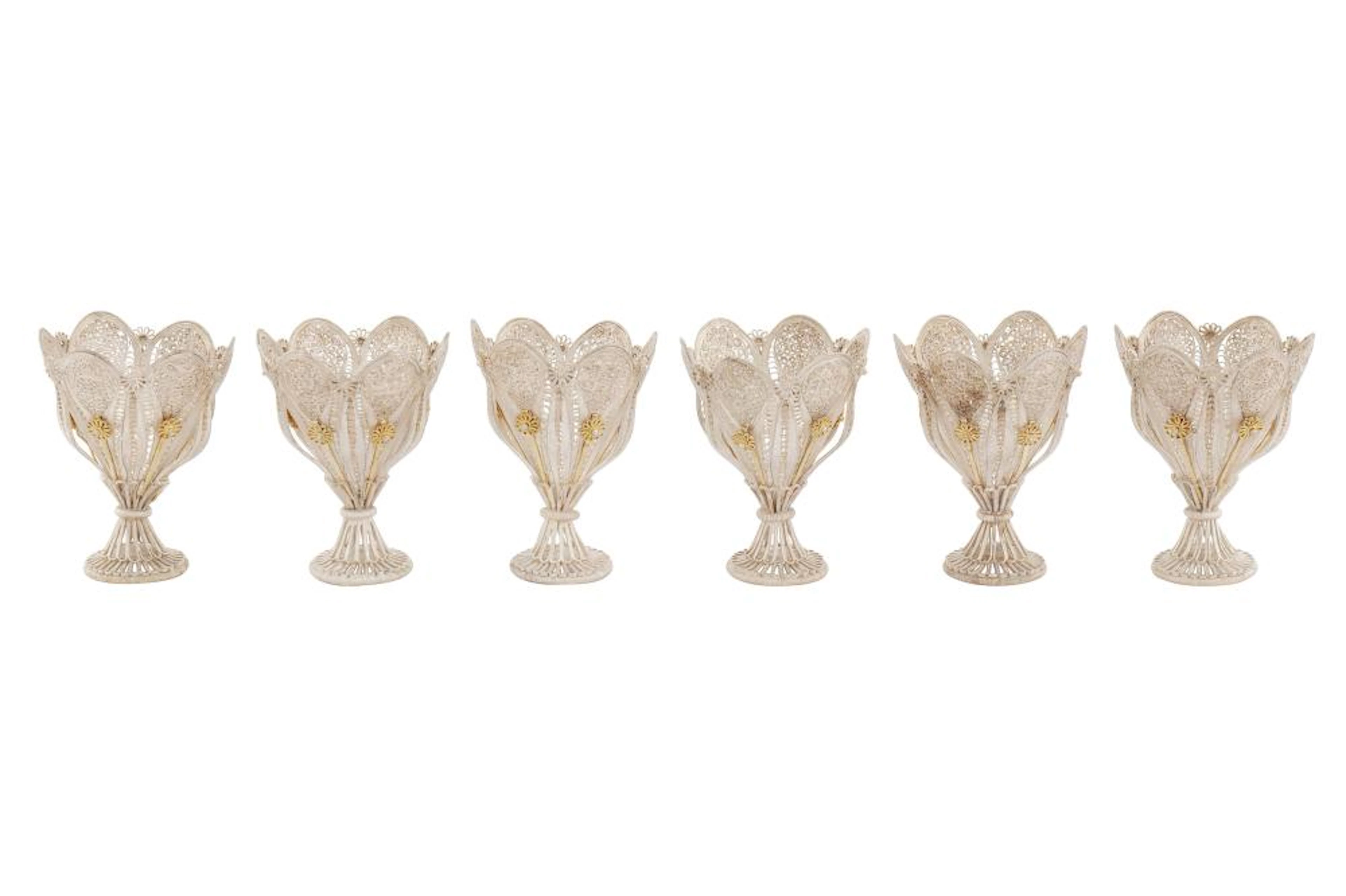 A SET OF SIX PARCEL-GILT SILVER FILIGREE ZARF CUPS Zanjan