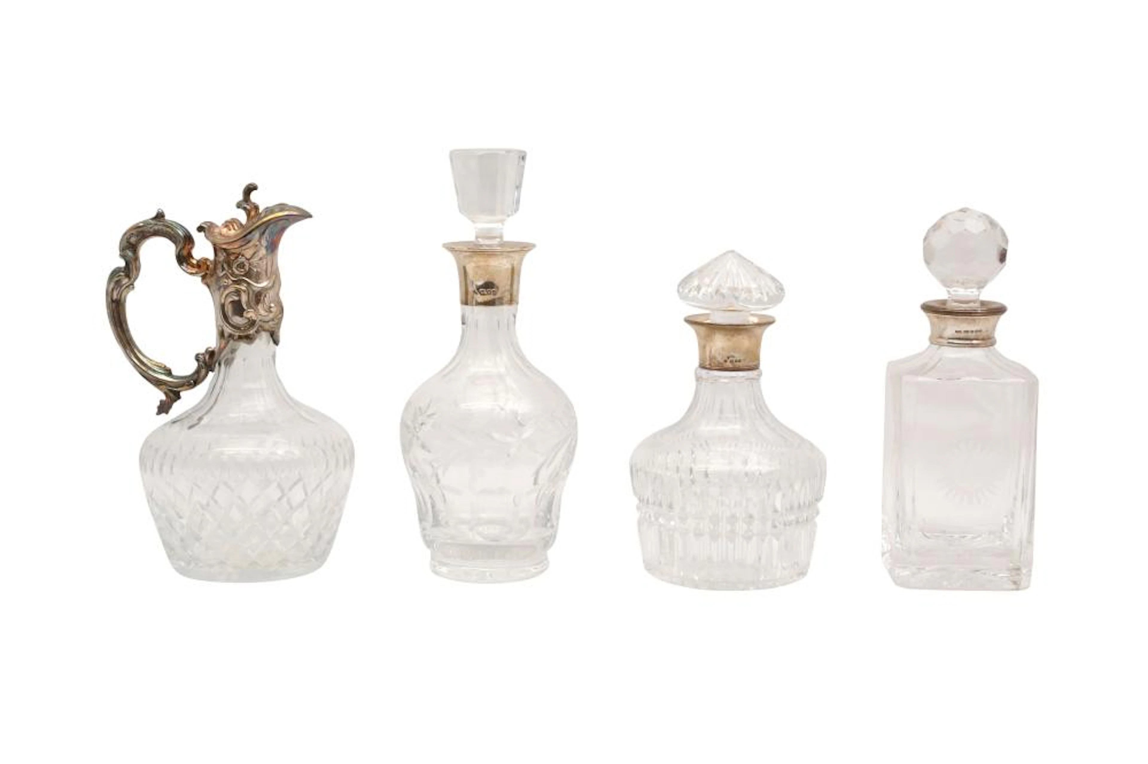 THREE CONTEMPORARY CRYSTAL DECANTERS WITH HALLMARKED STERLING SILVER COLLARS