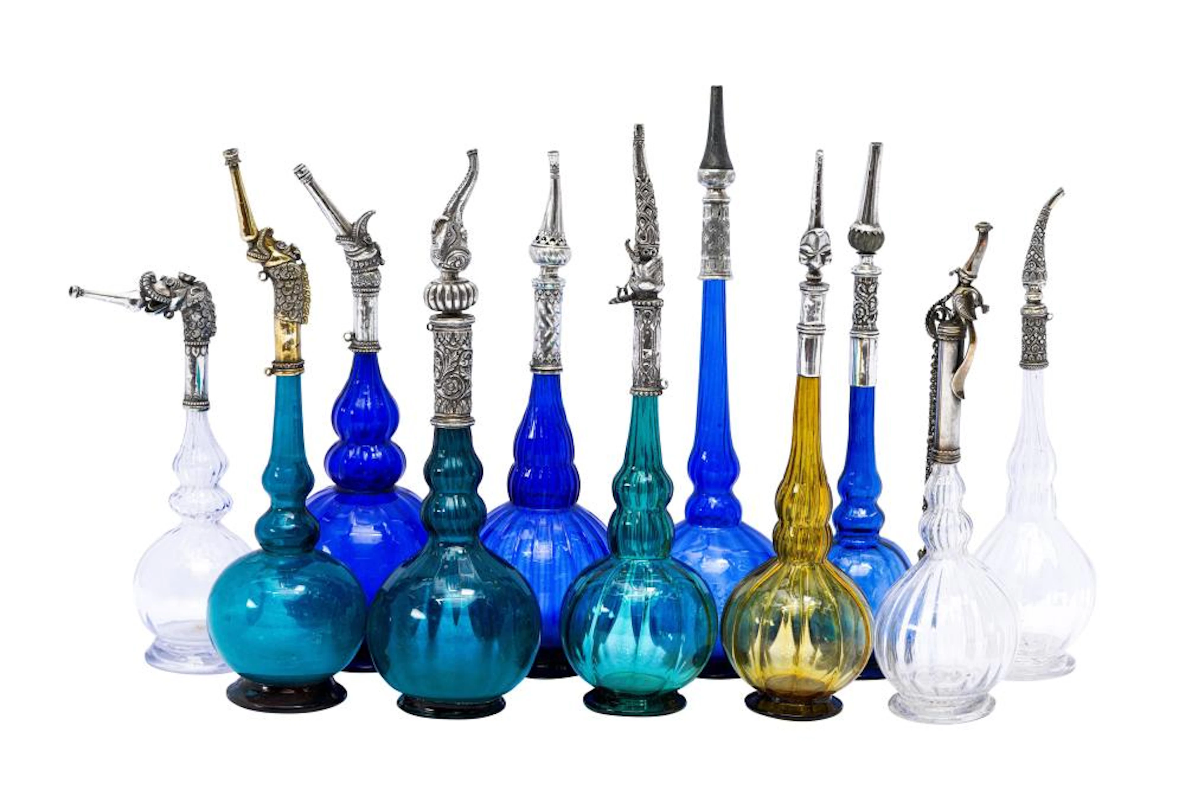 AN IMPRESSIVE GROUP OF ELEVEN MUGHAL MOULD-BLOWN GLASS...