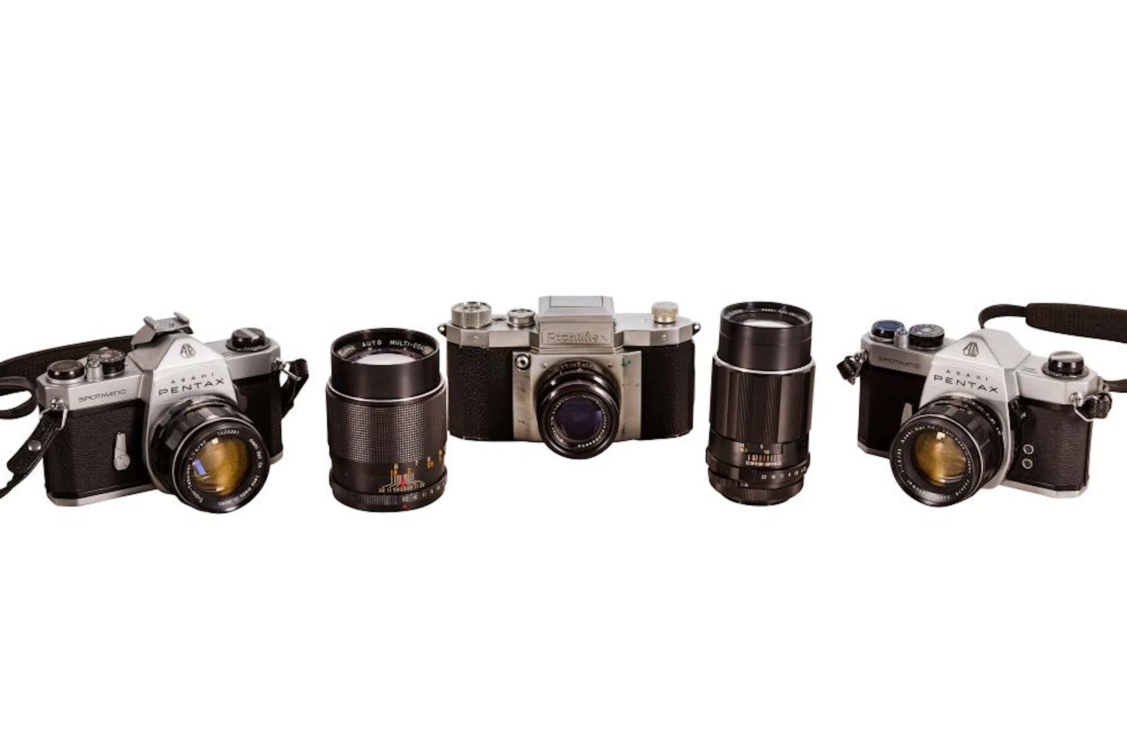 A Pair Of Pentax SP Camera Outfits With Praktiflex Outfit