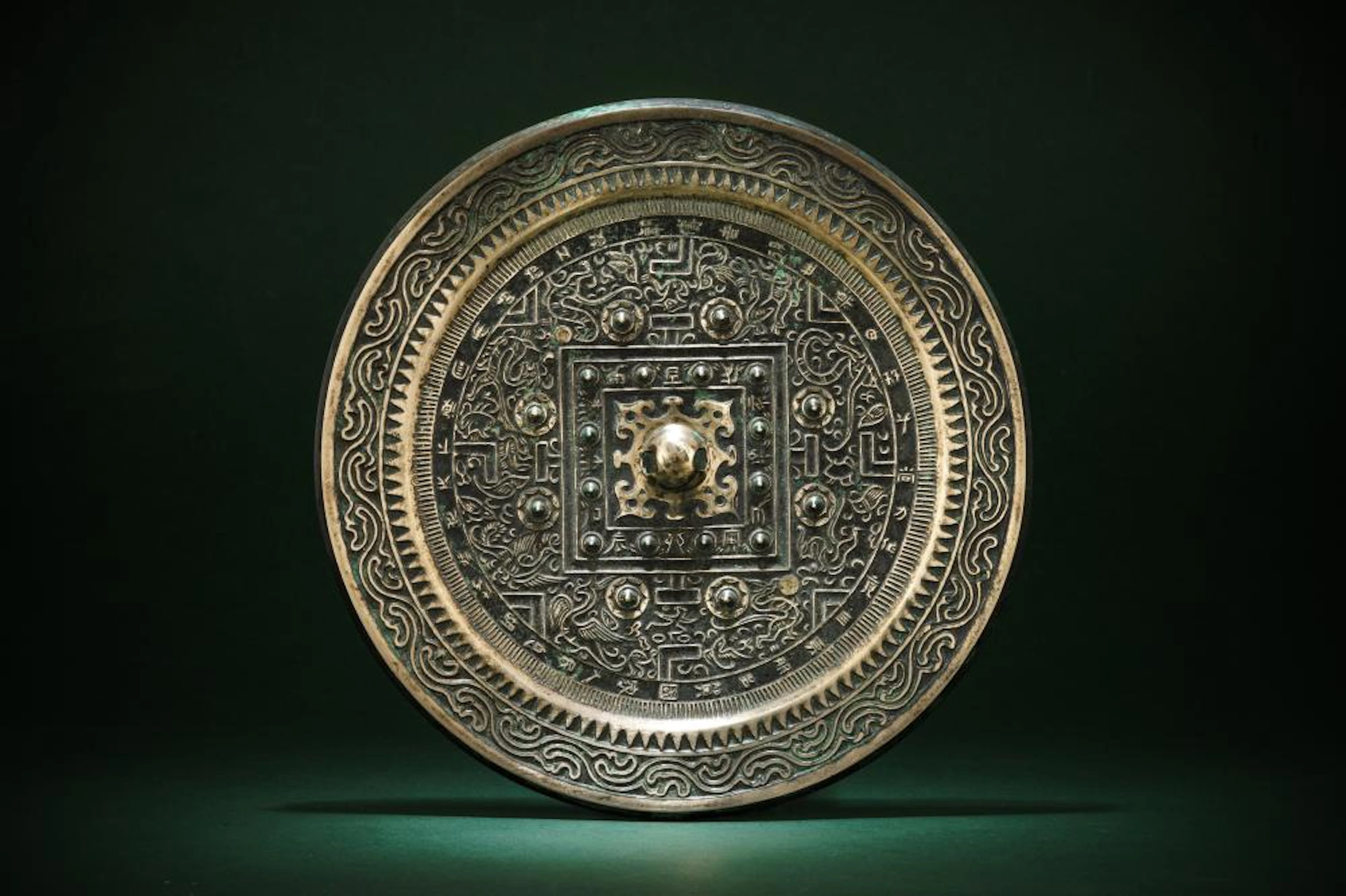 A CHINESE BRONZE 'TLV' MIRROR ??