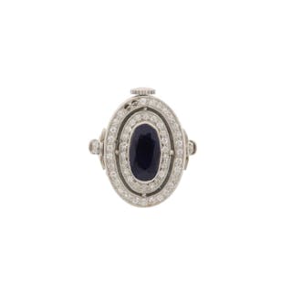 A SAPPHIRE AND DIAMOND WATCH RING